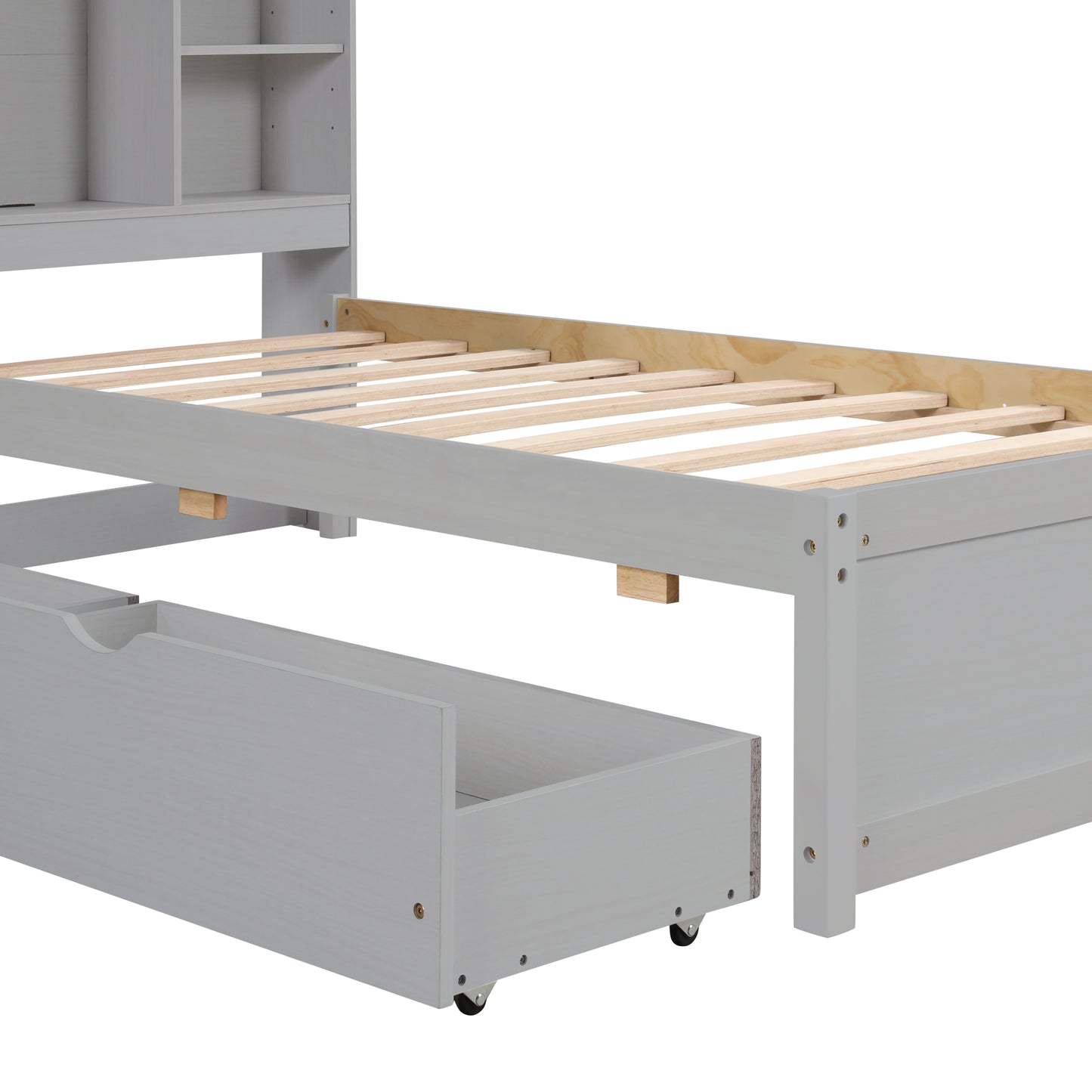 Gray twin bed frame with exposed wooden slats and a rolling storage drawer open