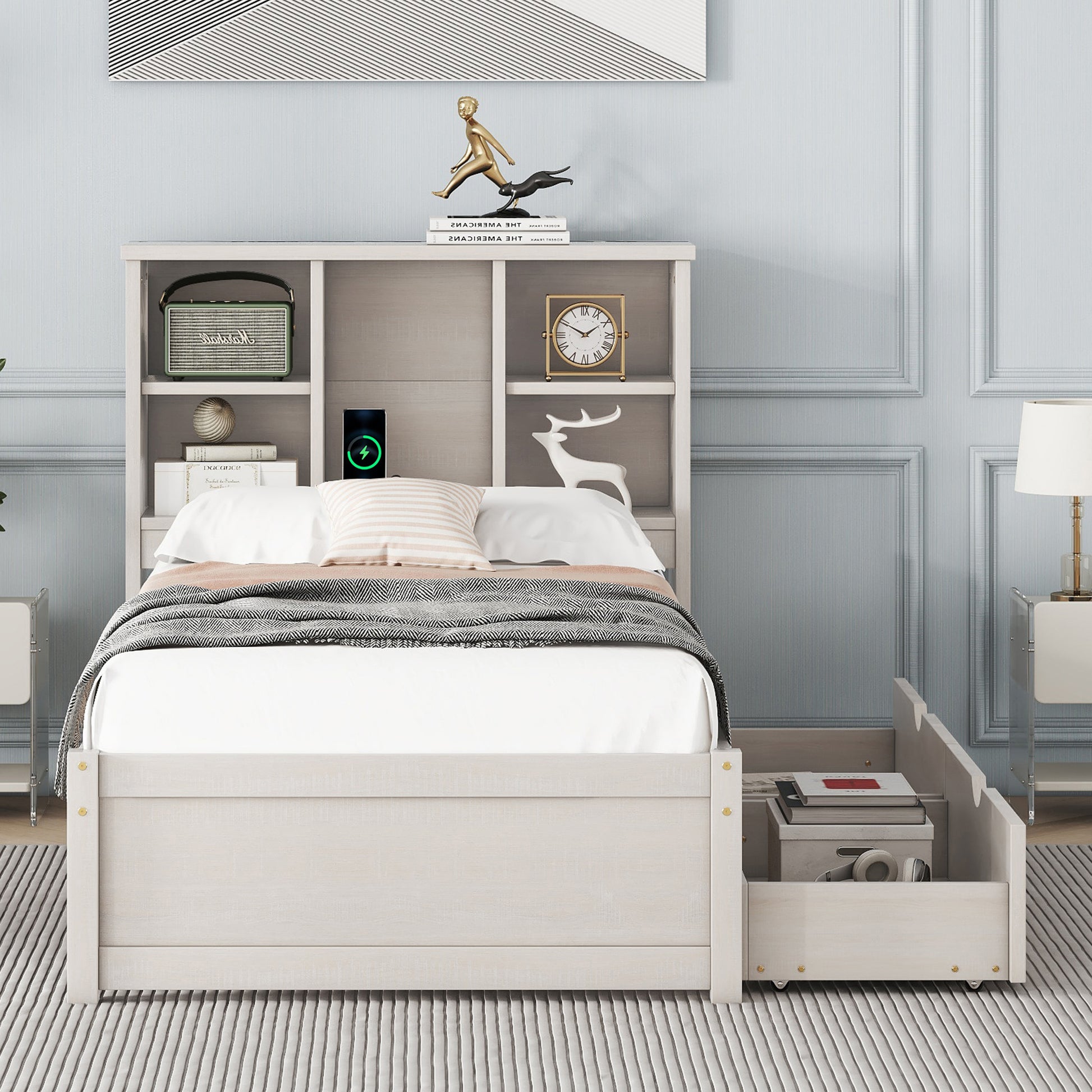 White twin bed with storage drawers and headboard shelving