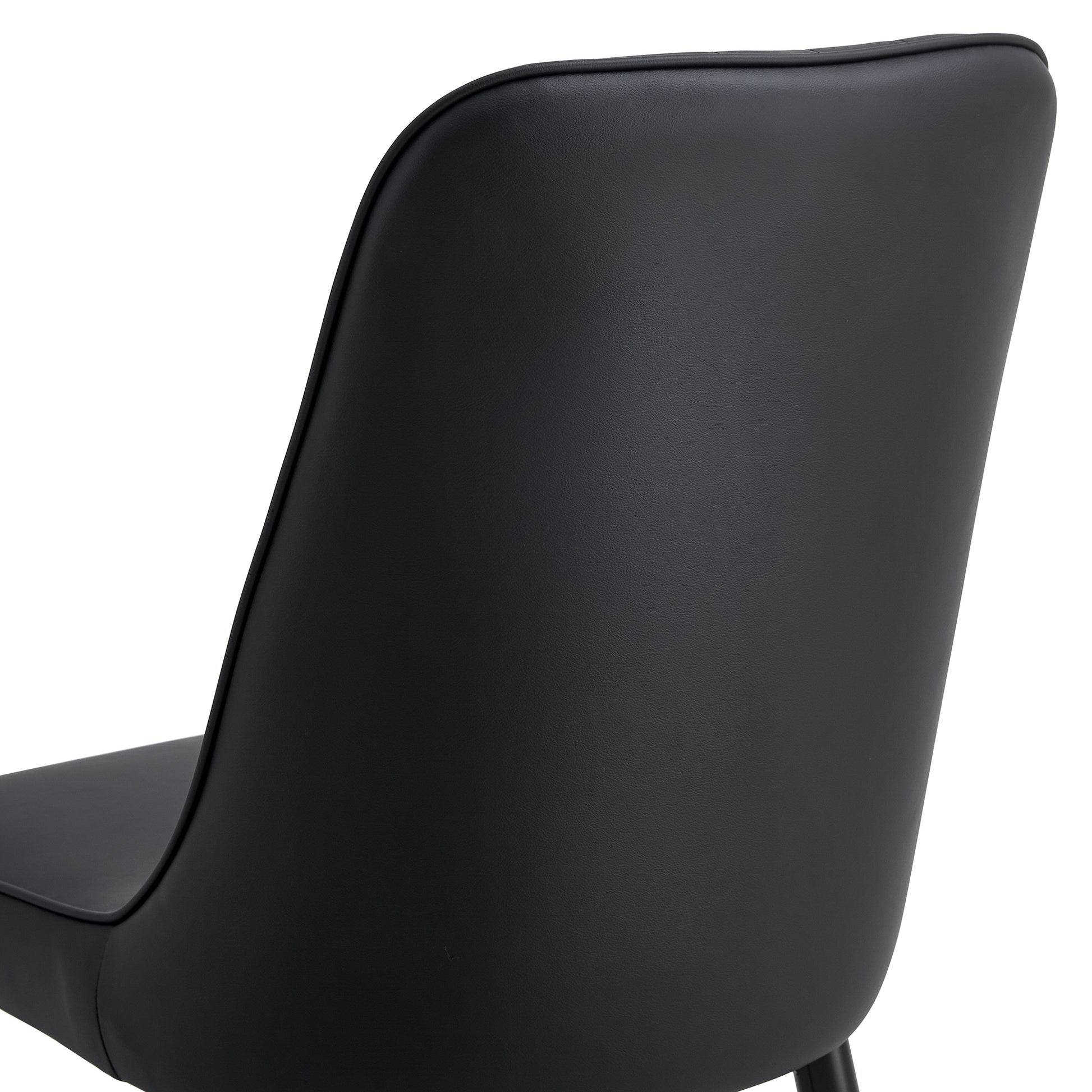 Black faux leather dining chair back and seat detail