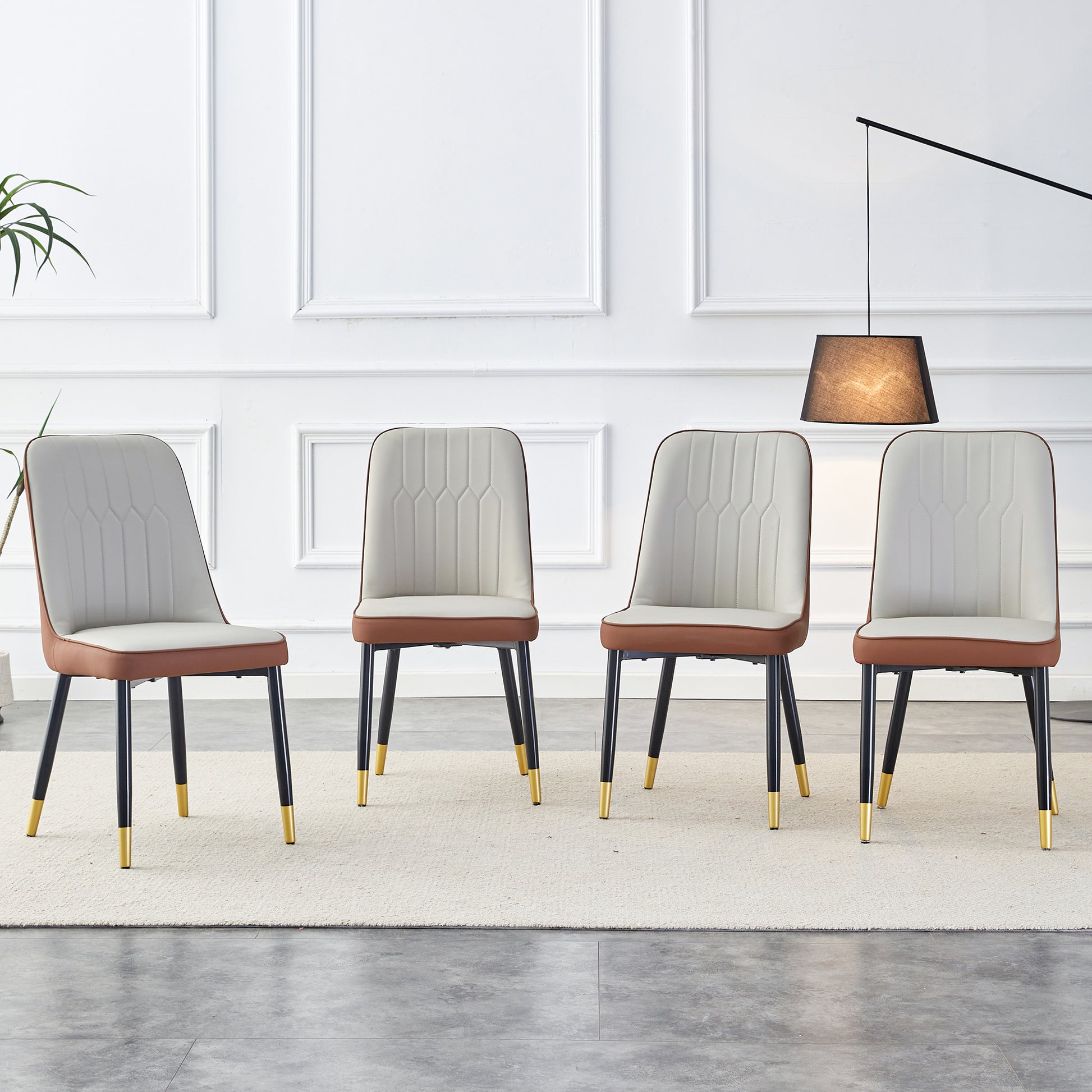 Four upholstered dining chairs with white seats and brown trim