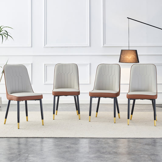 Four upholstered dining chairs with white seats and brown trim