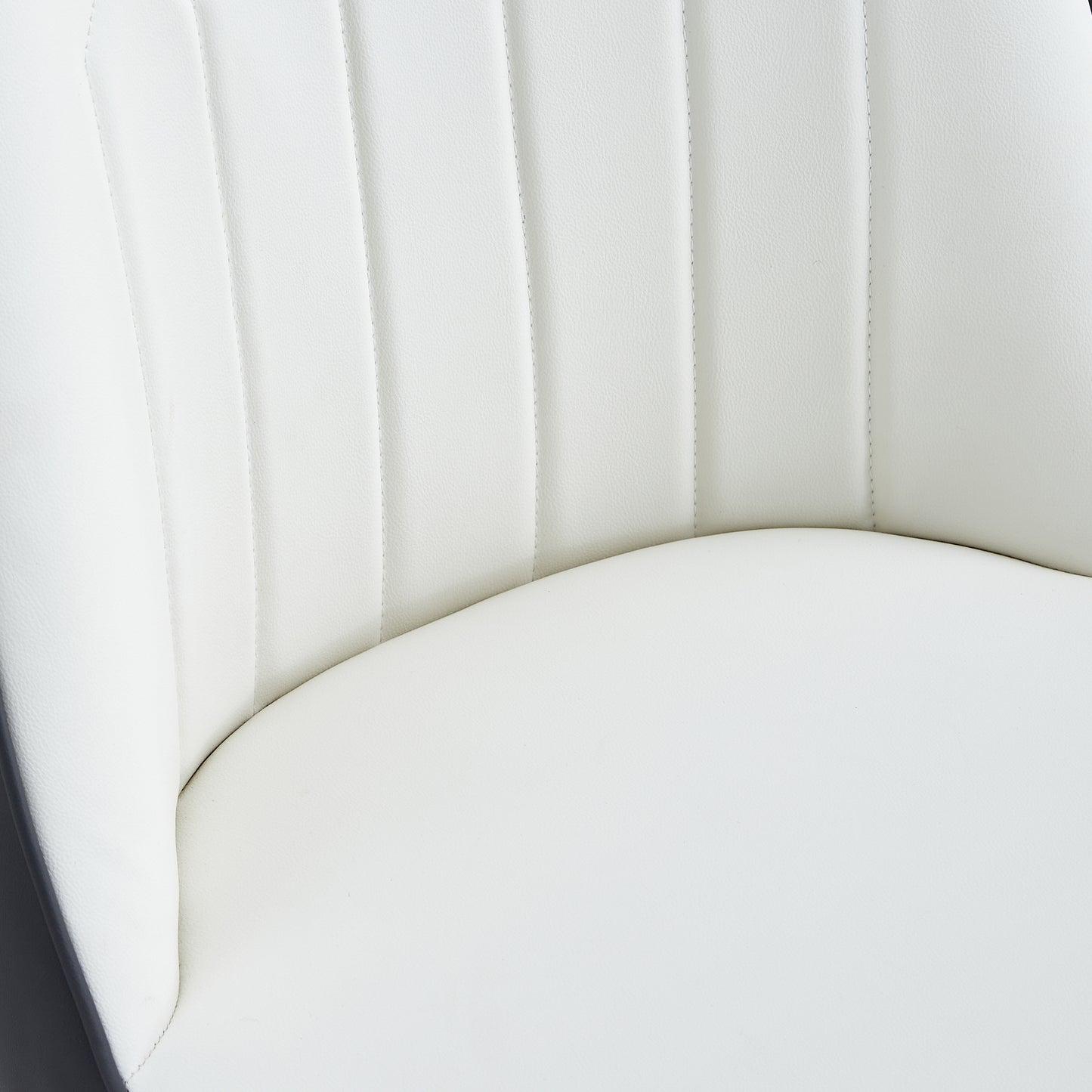Closeup of white padded leather seat with vertical channel tufting