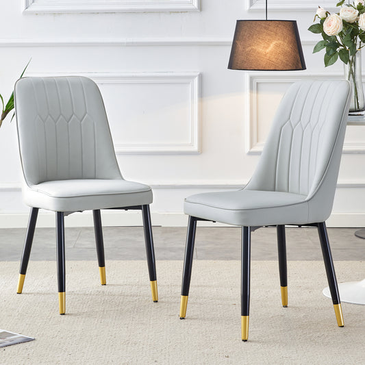 Light gray upholstered dining chair with diamond stitching on back
