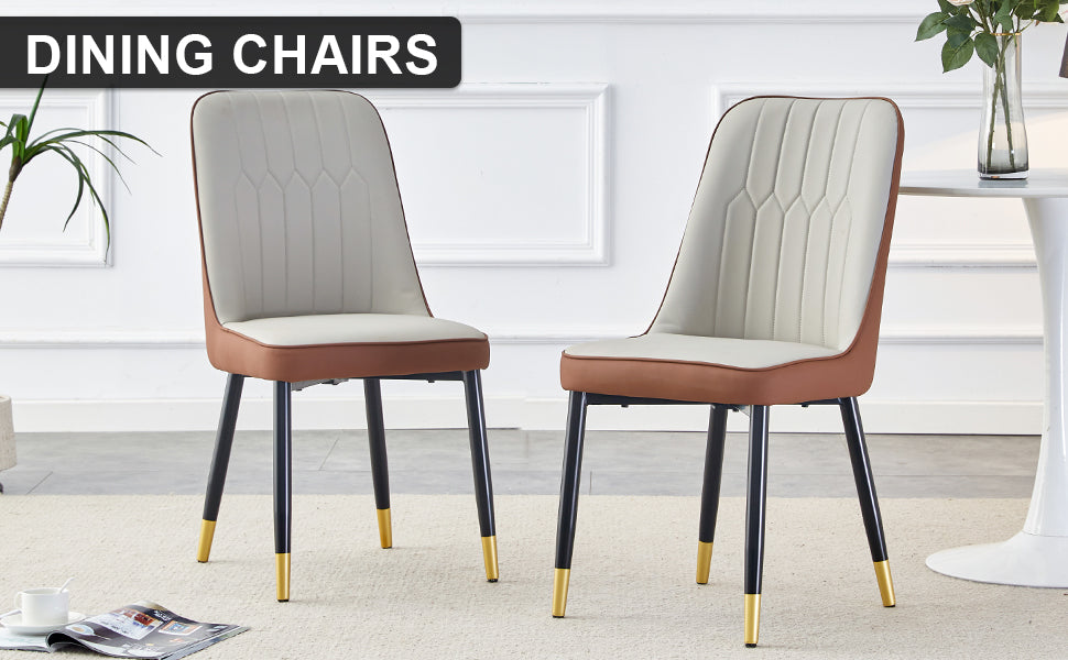 Cream and brown upholstered dining chairs with black legs and gold accents