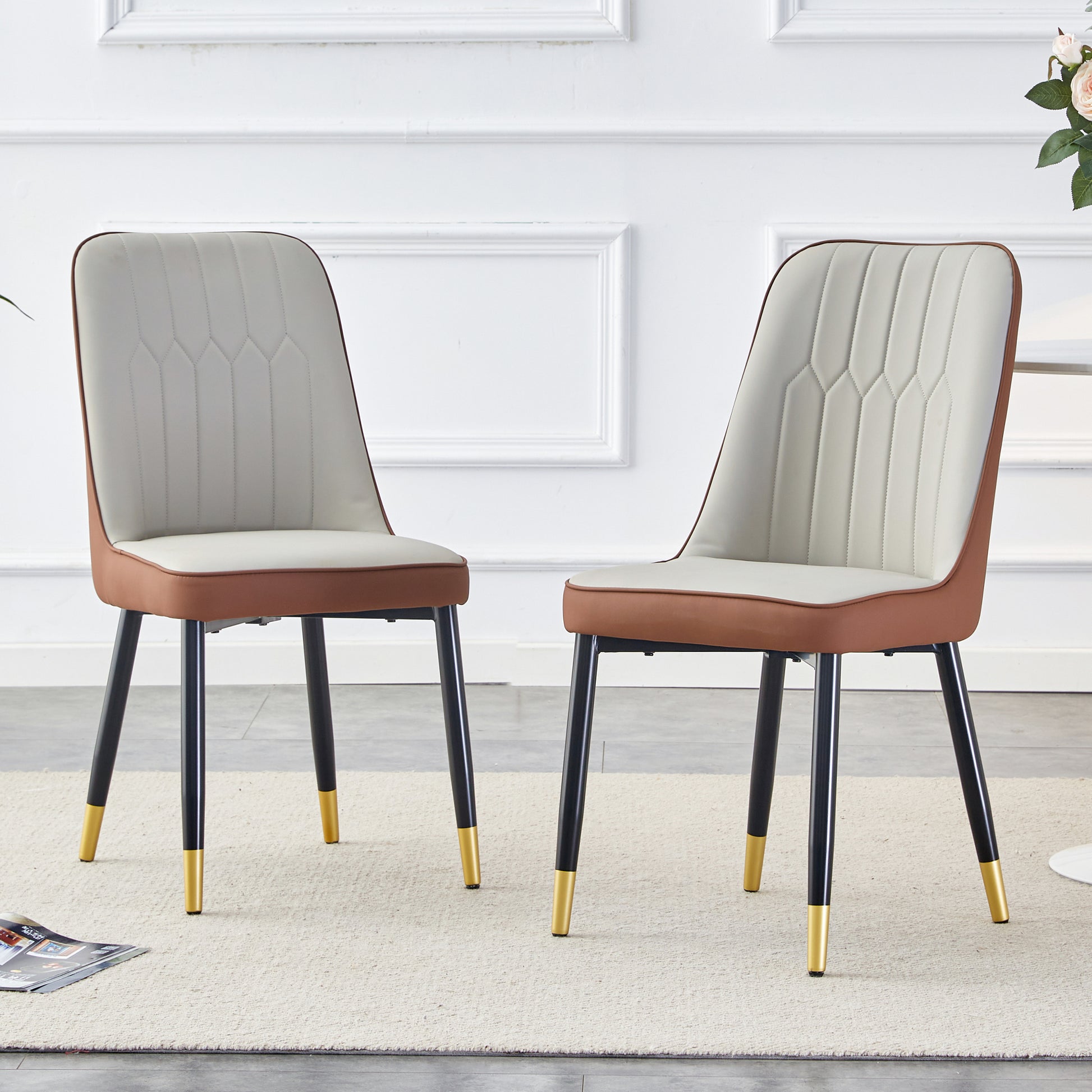 Elegant cream dining chair with brown trim and goldtipped legs