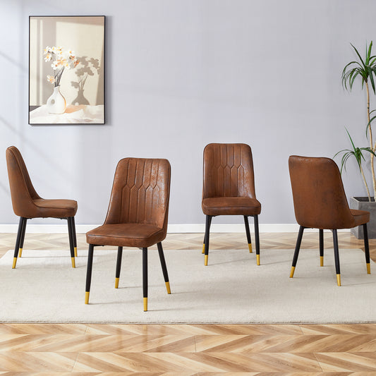 Set of four brown faux leather dining chairs with black legs and gold accents