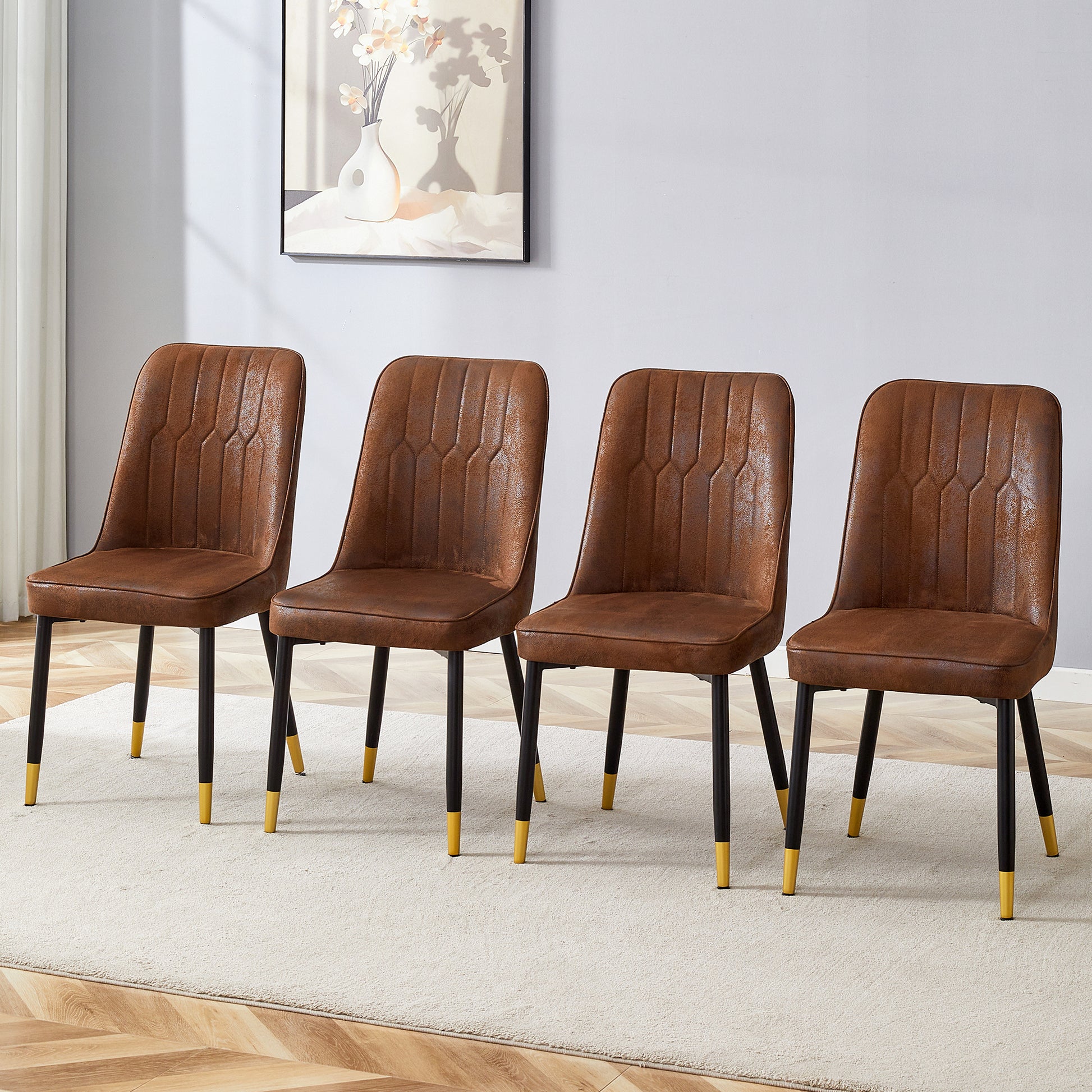 Brown upholstered dining chairs with quilted stitching and black metal legs