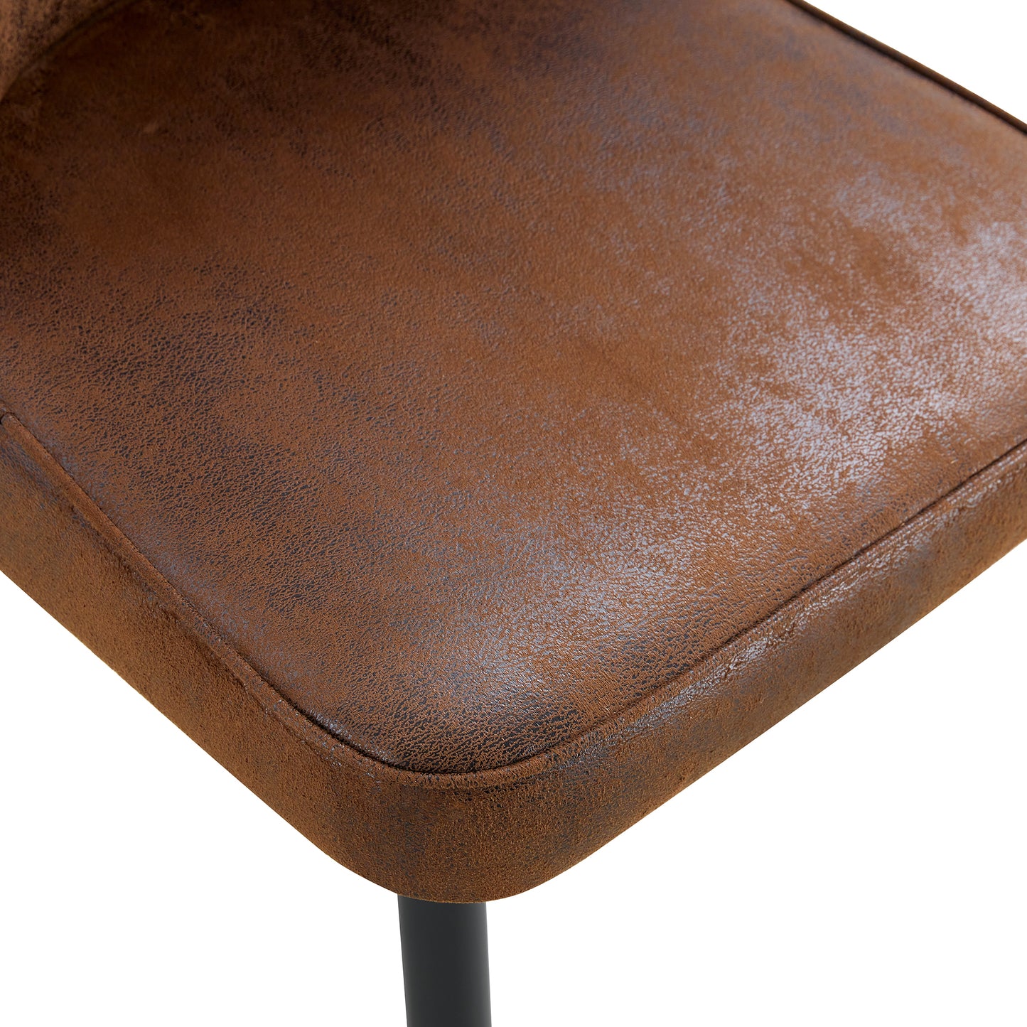 Closeup of distressed brown faux leather seat cushion with subtle grey undertones