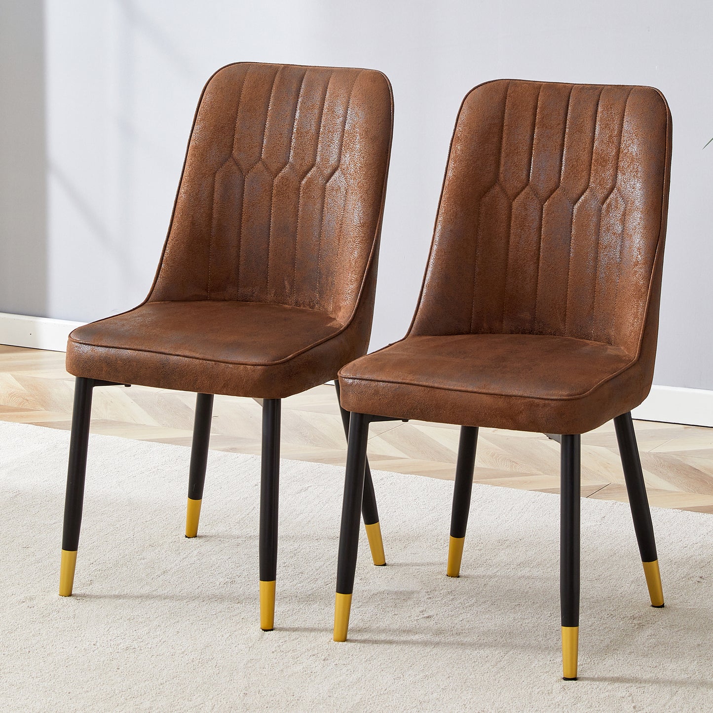 Pair of distressed brown faux leather dining chairs with diamond tufting