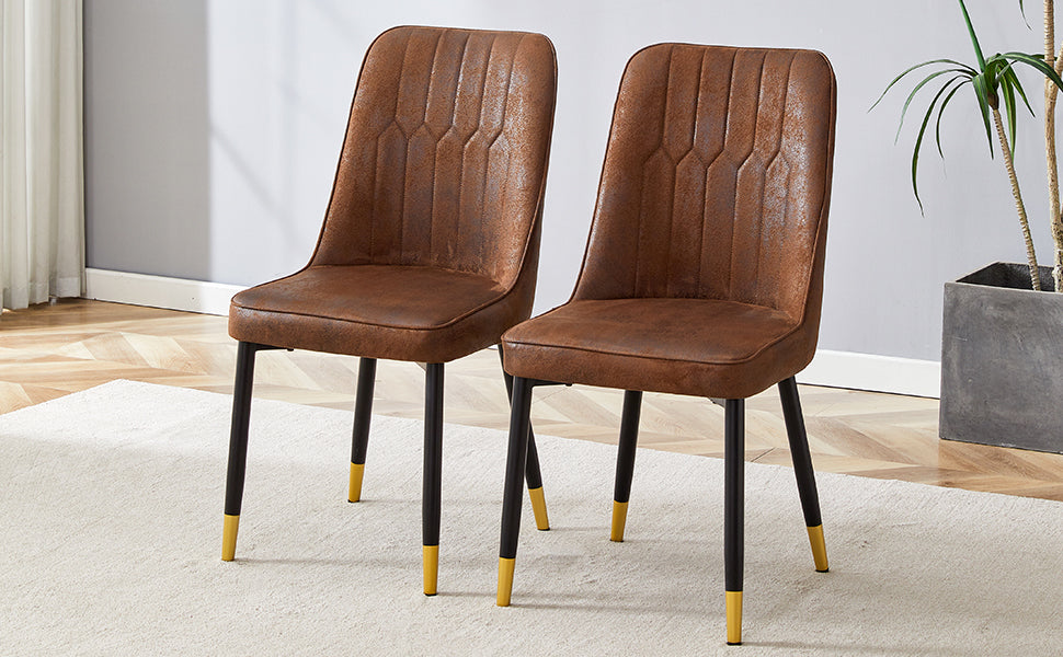 Brown faux leather dining chair with tufted back and goldtipped legs