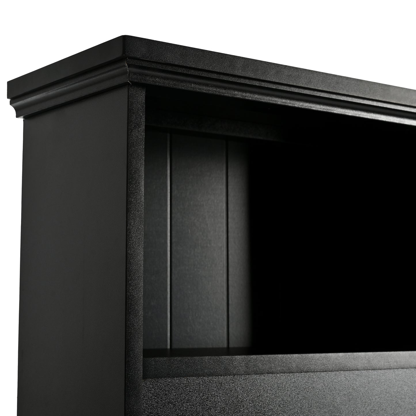 Black wooden bookcase detail with ornate top molding and paneled back