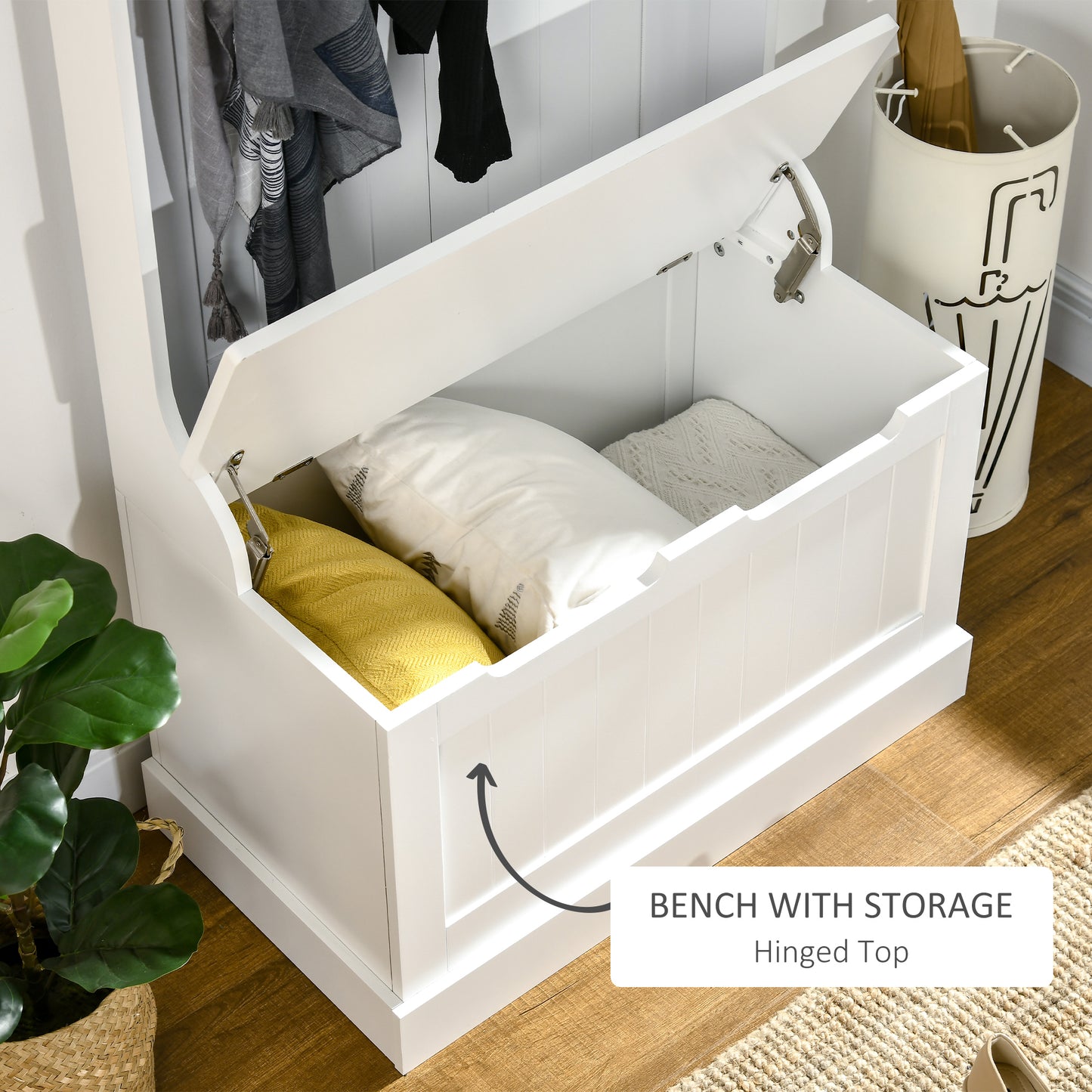 White storage bench with hinged lid revealing cushions and blankets