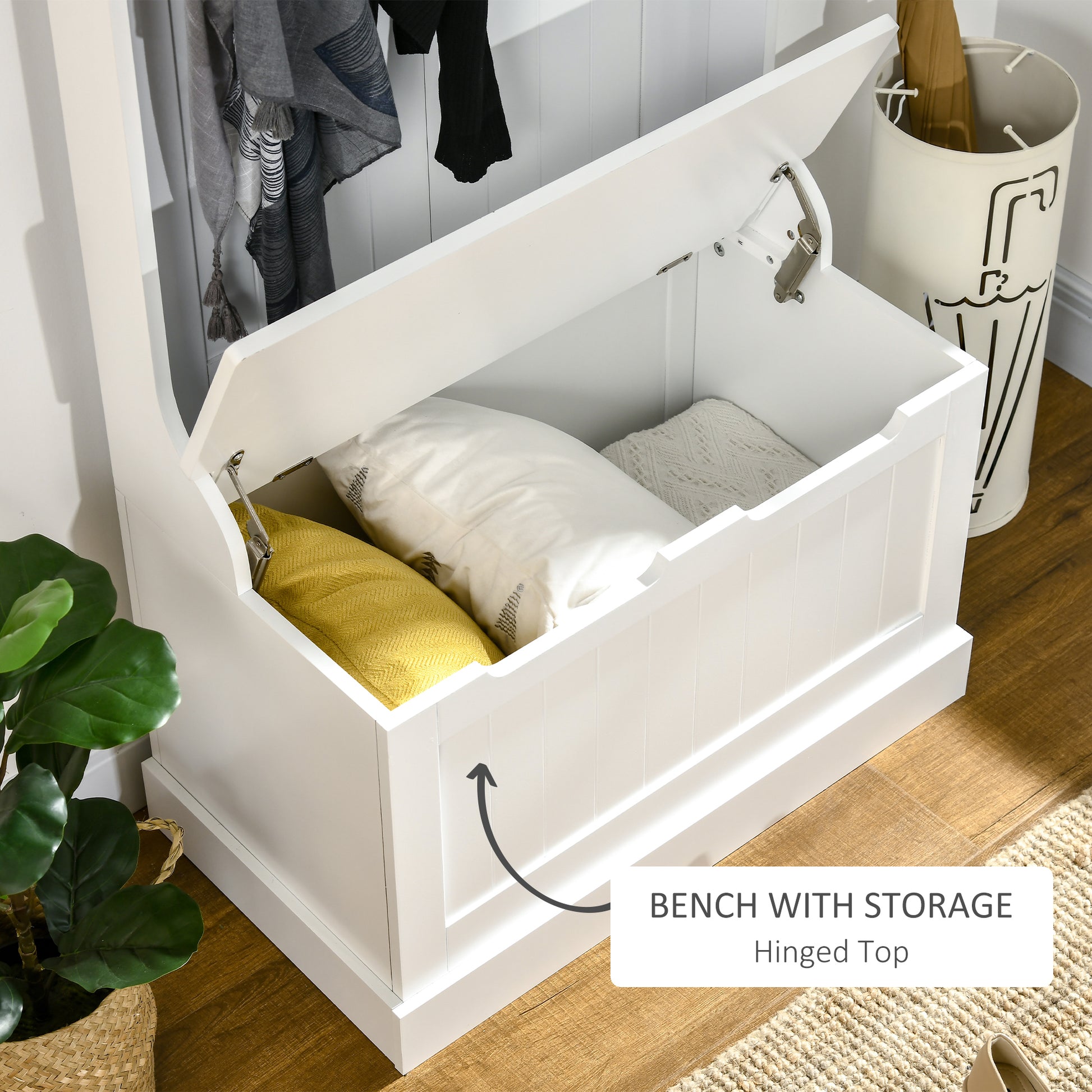 White storage bench with hinged lid revealing cushions and blankets