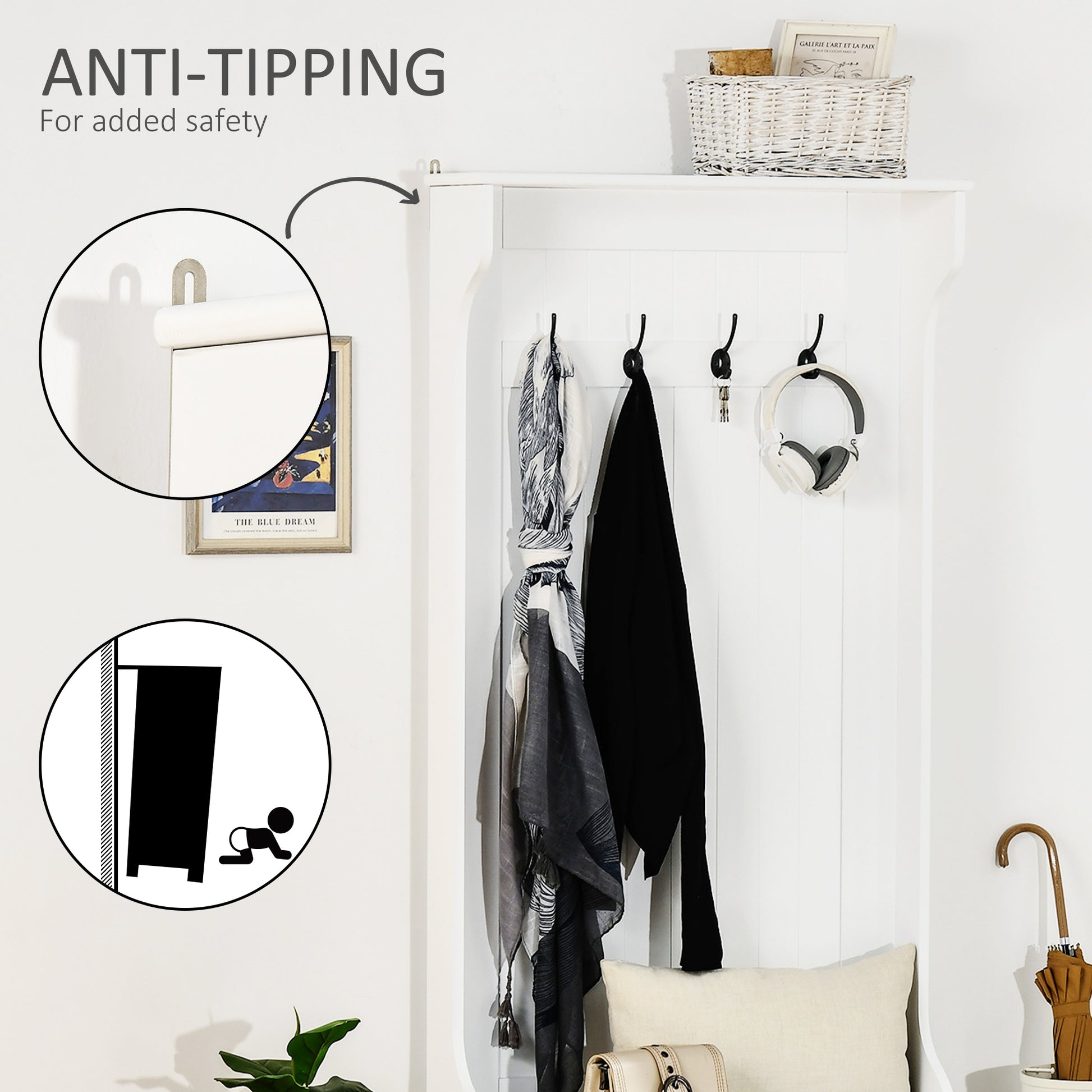 White entryway organizer with hooks holding scarves and headphones