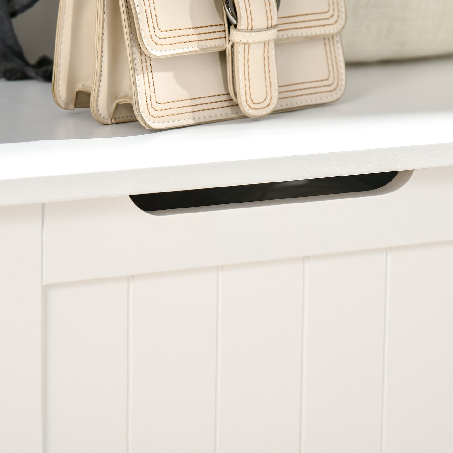 Cream leather crossbody handbag with contrast stitching and buckle closure