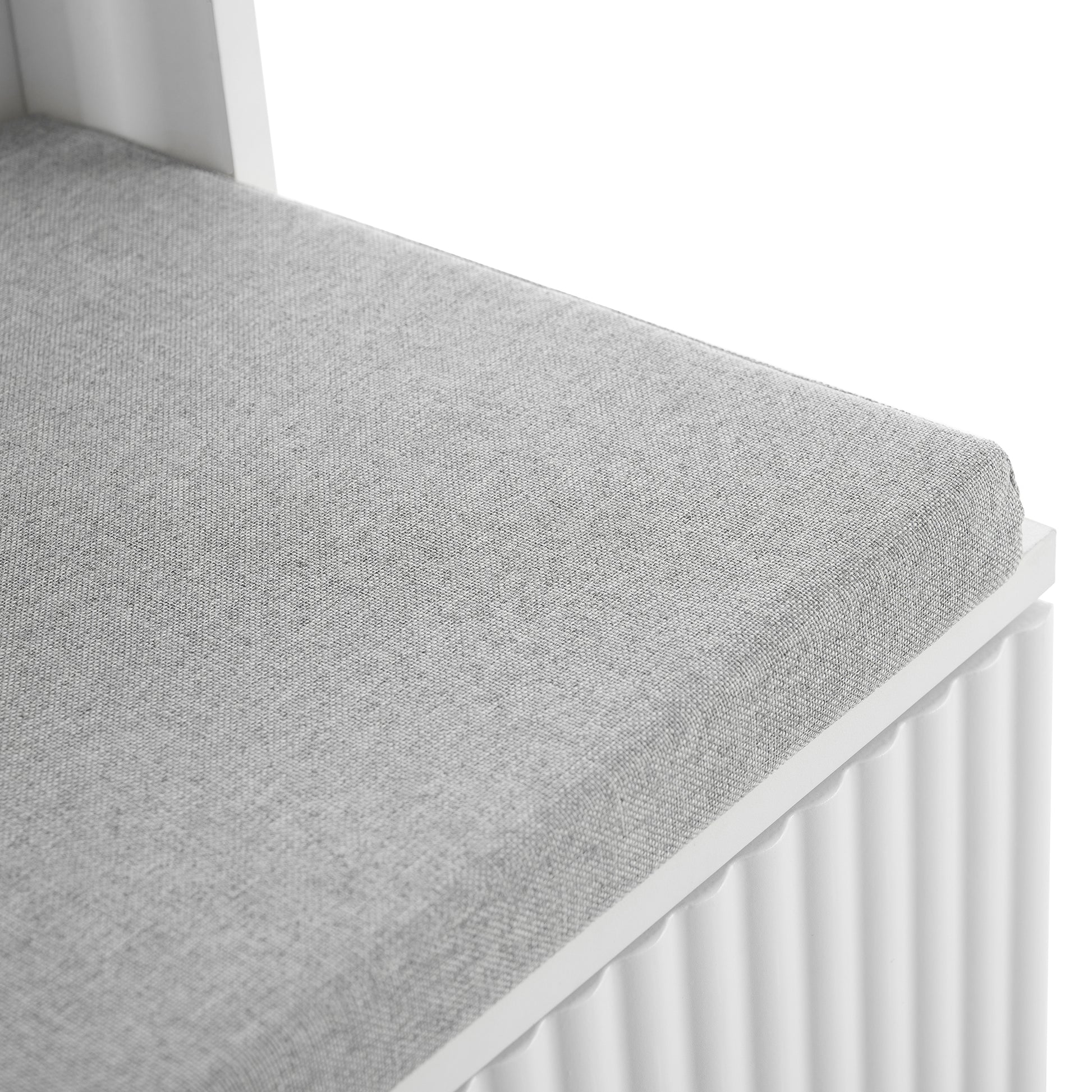 Gray upholstered bench cushion with textured fabric detail