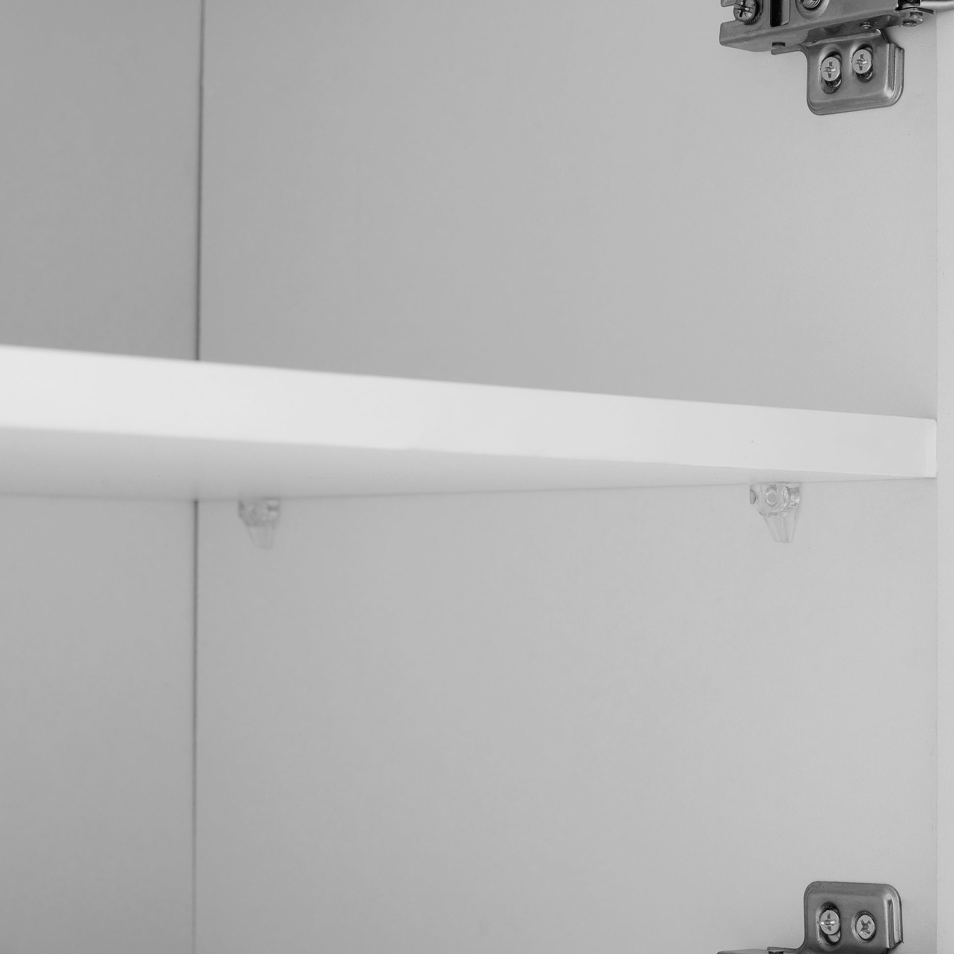 White cabinet shelf with clear plastic supports