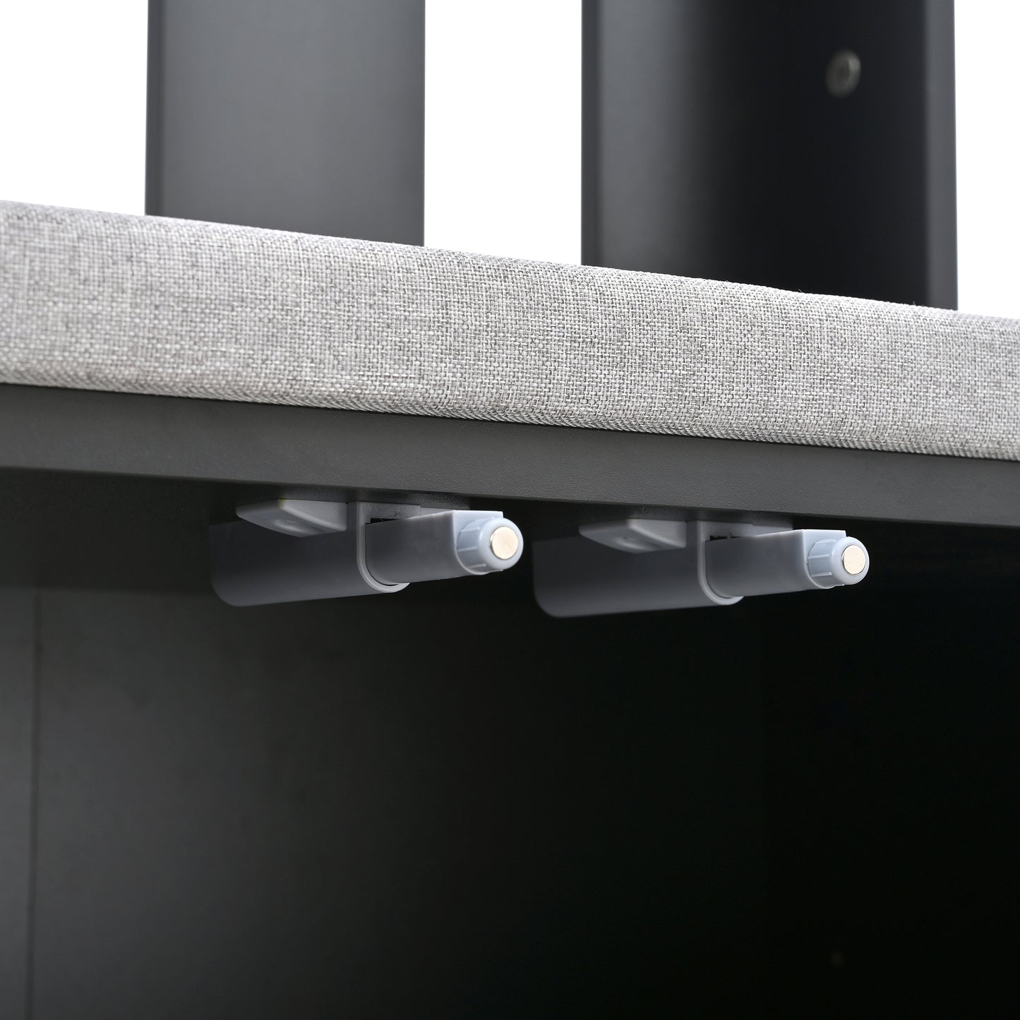 Closeup of gray fabric bed frame with magnetic touch latch