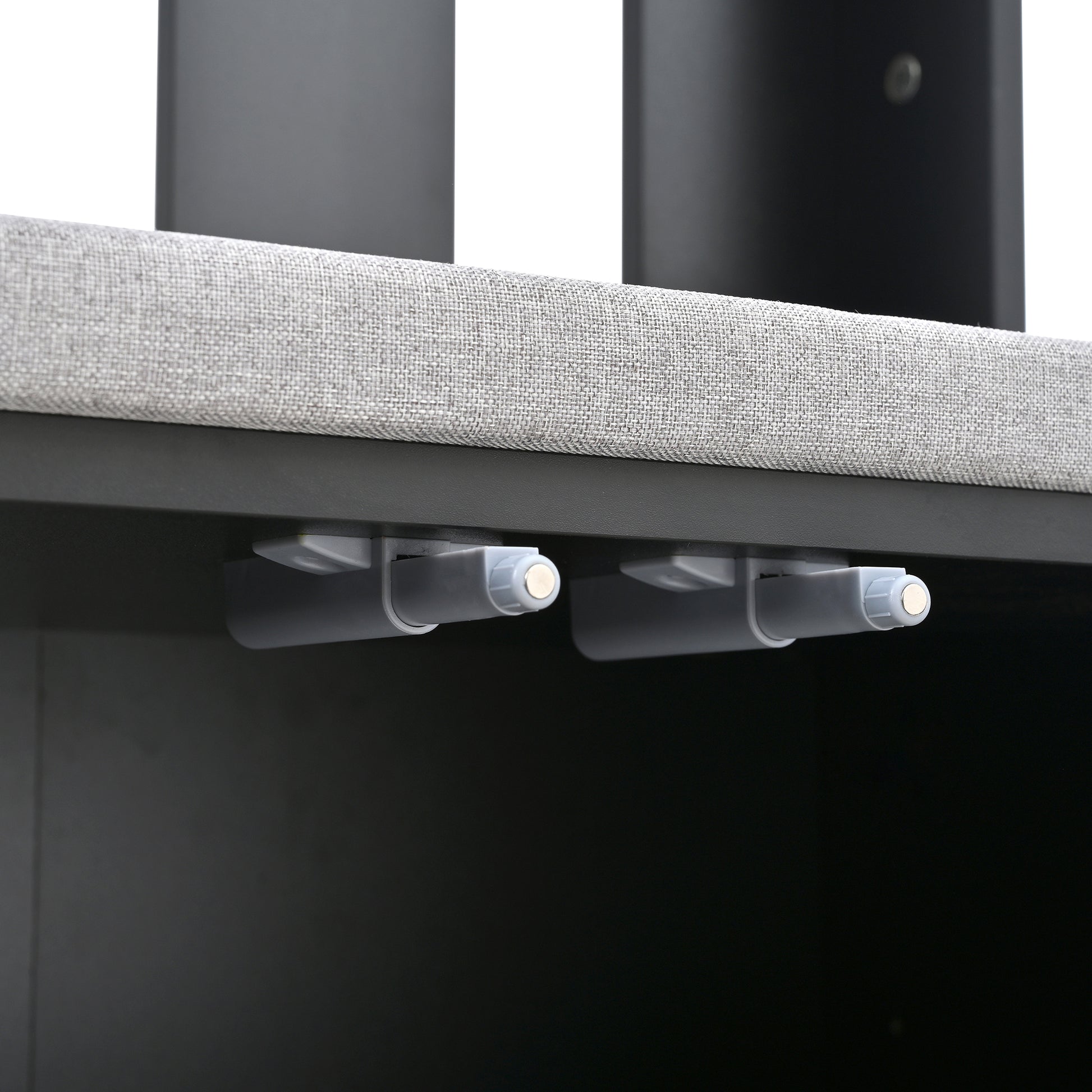 Closeup of gray fabric bed frame with magnetic touch latch