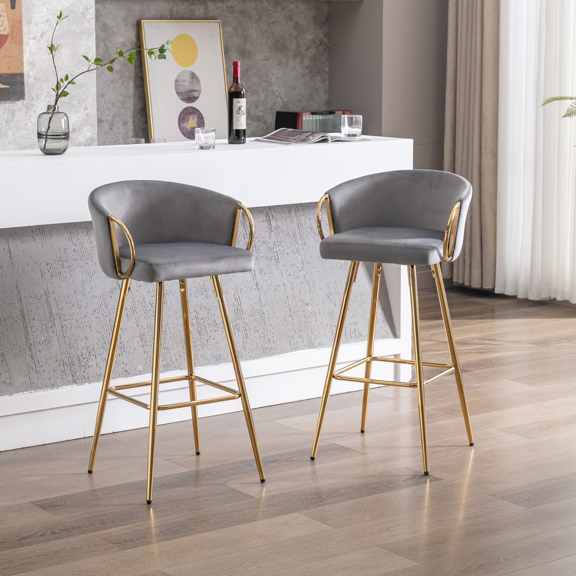 Elegant grey velvet bar stool with gold legs and curved back