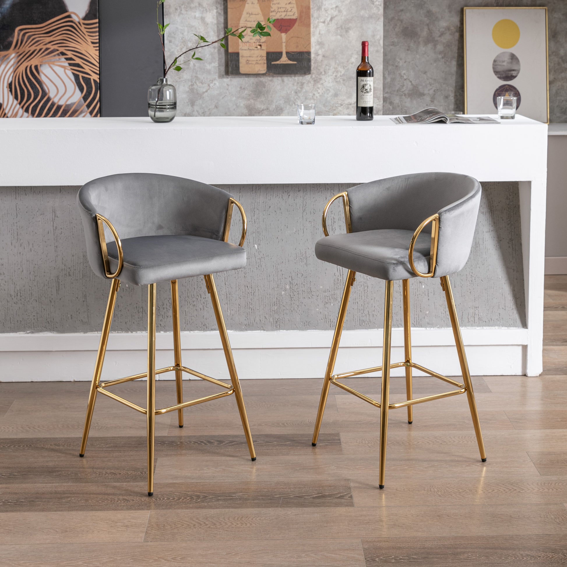 Grey velvet bar stool with gold legs and arms