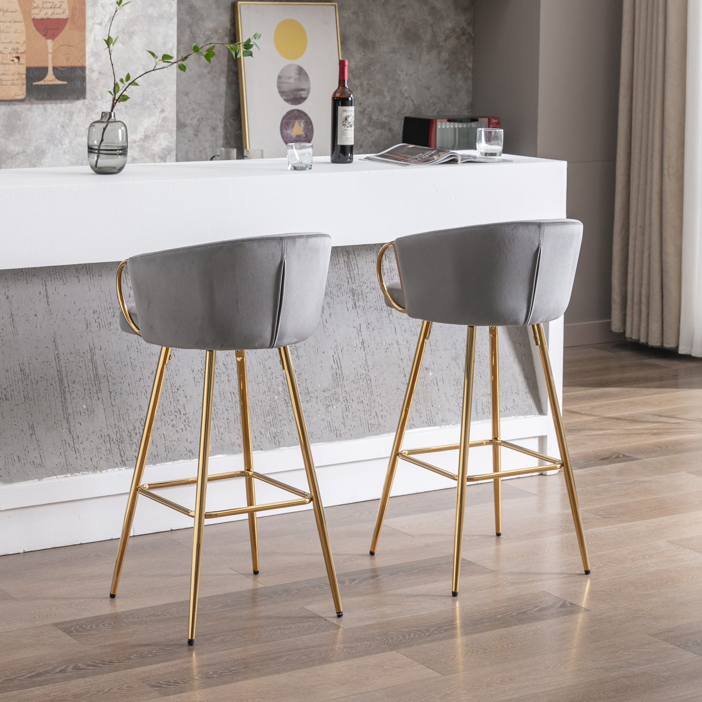 Grey velvet bar stool with curved back and gold legs perfect for a modern kitchen island