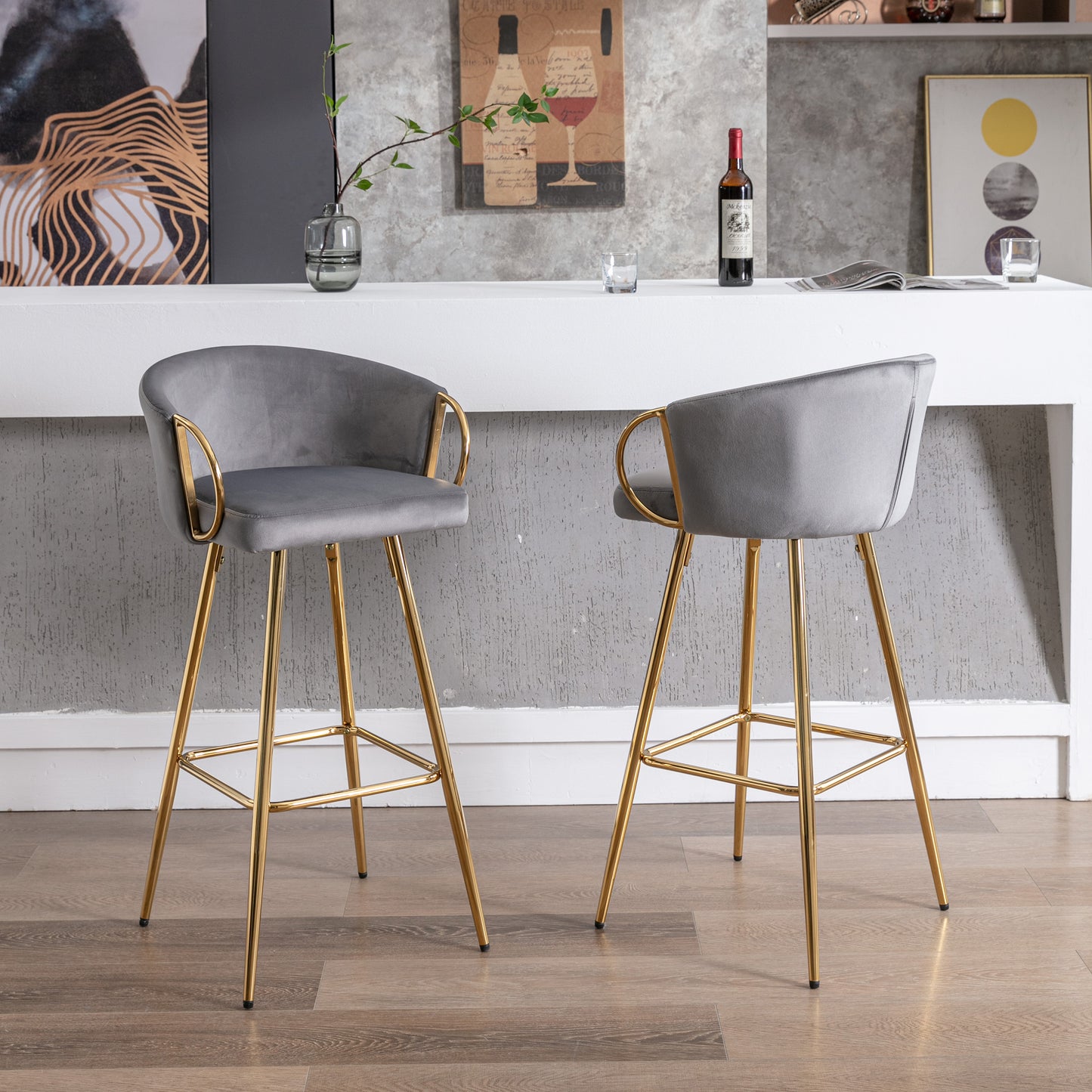 Grey velvet bar stool with gold legs and armrests