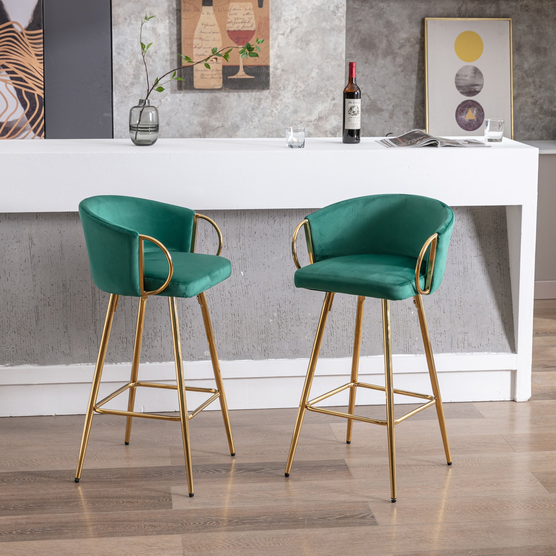 Emerald green velvet bar stool with gold legs and curved backrest
