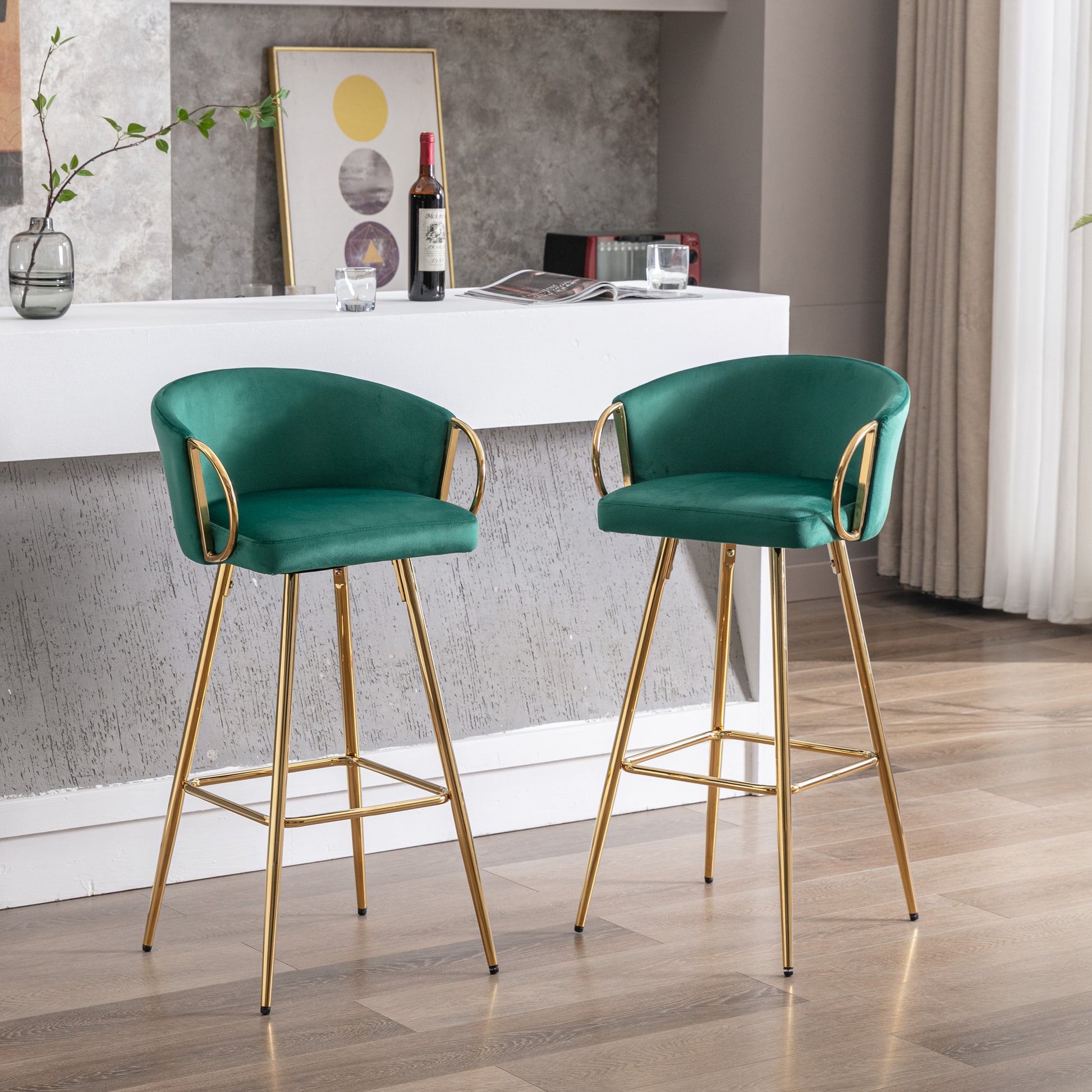 Emerald green velvet bar stool with gold legs and armrests
