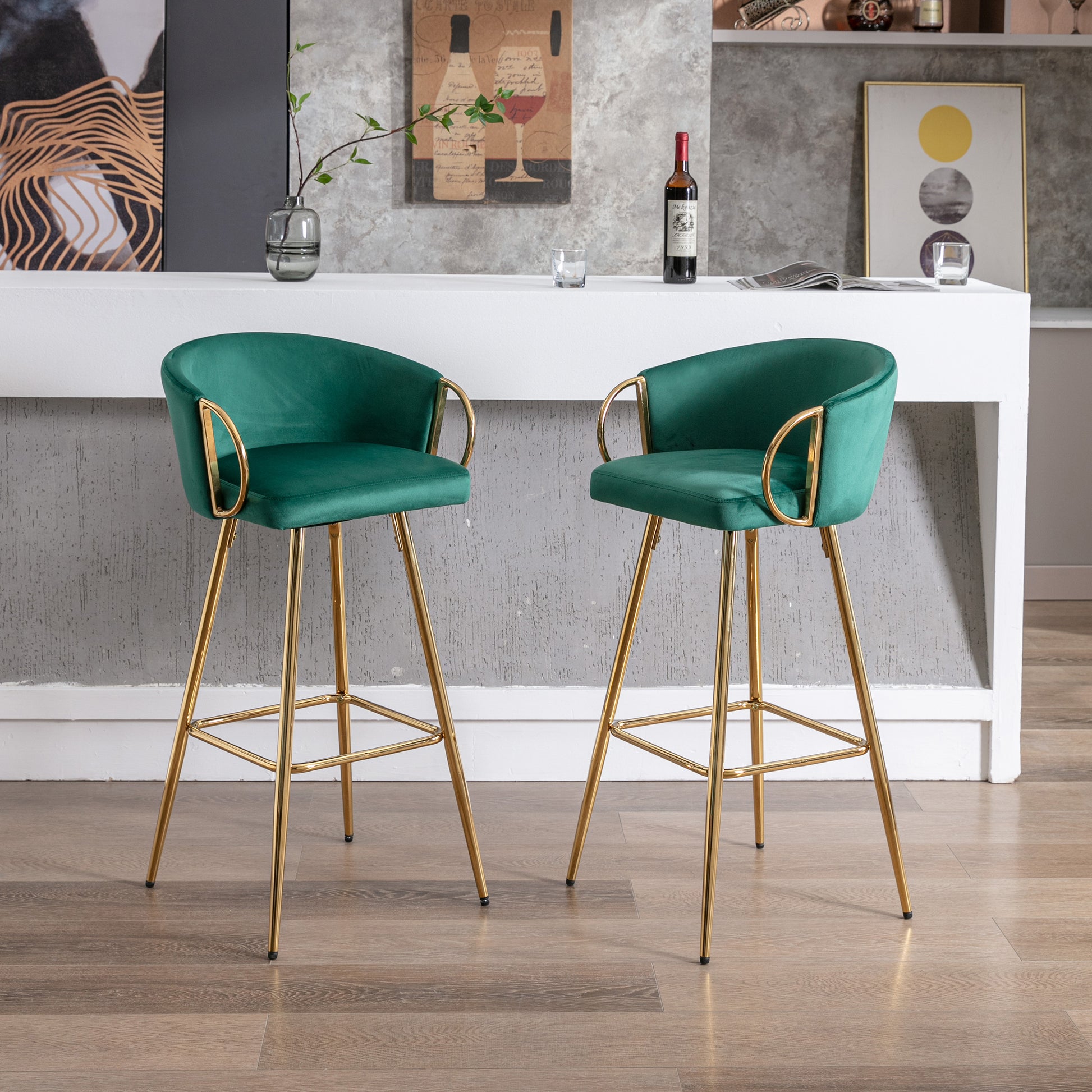 Emerald green velvet bar stool with gold legs and curved arms