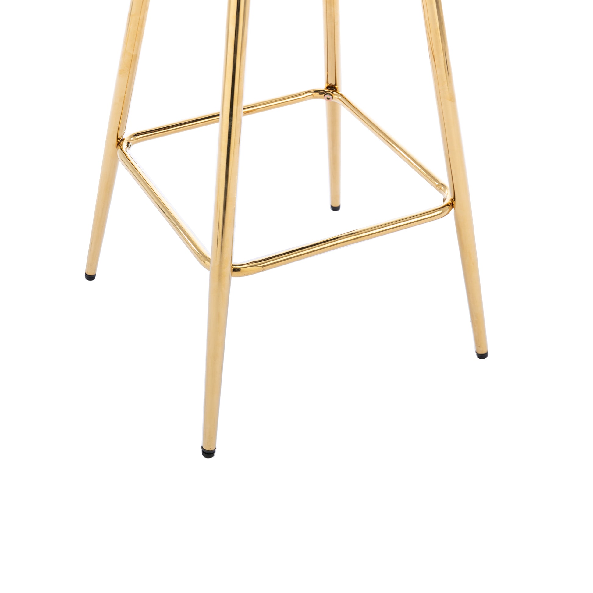 Closeup of gold metal bar stool legs and footrest