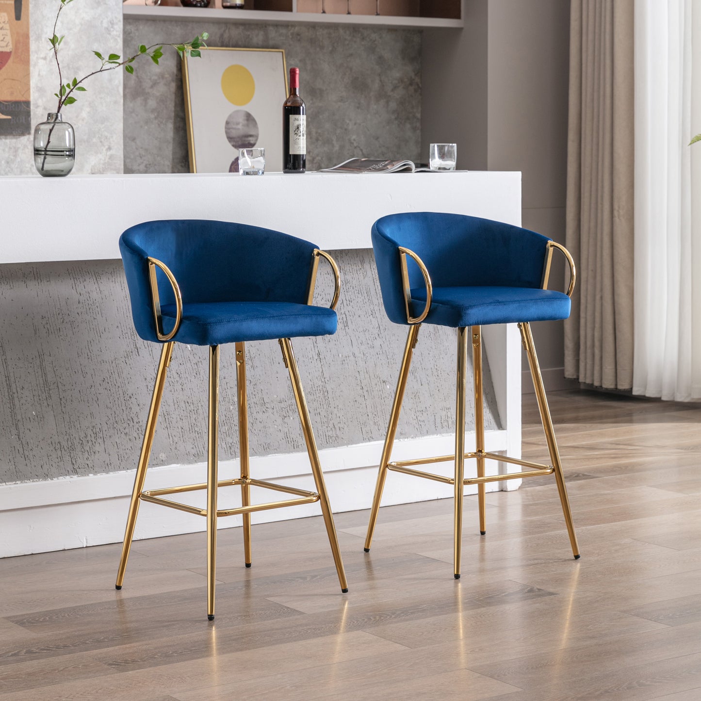 Pair of navy blue velvet bar stools with gold metal legs