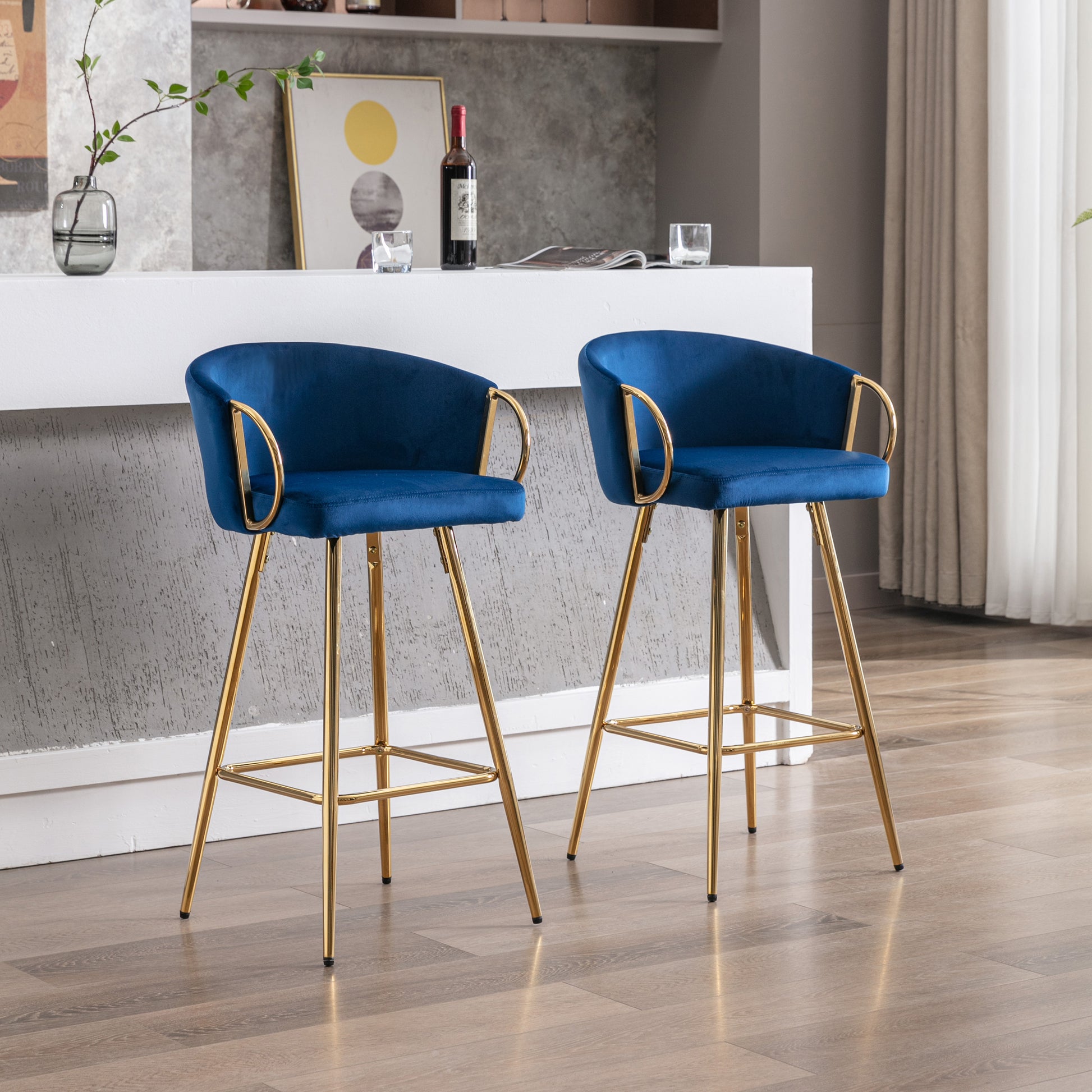 Pair of navy blue velvet bar stools with gold metal legs