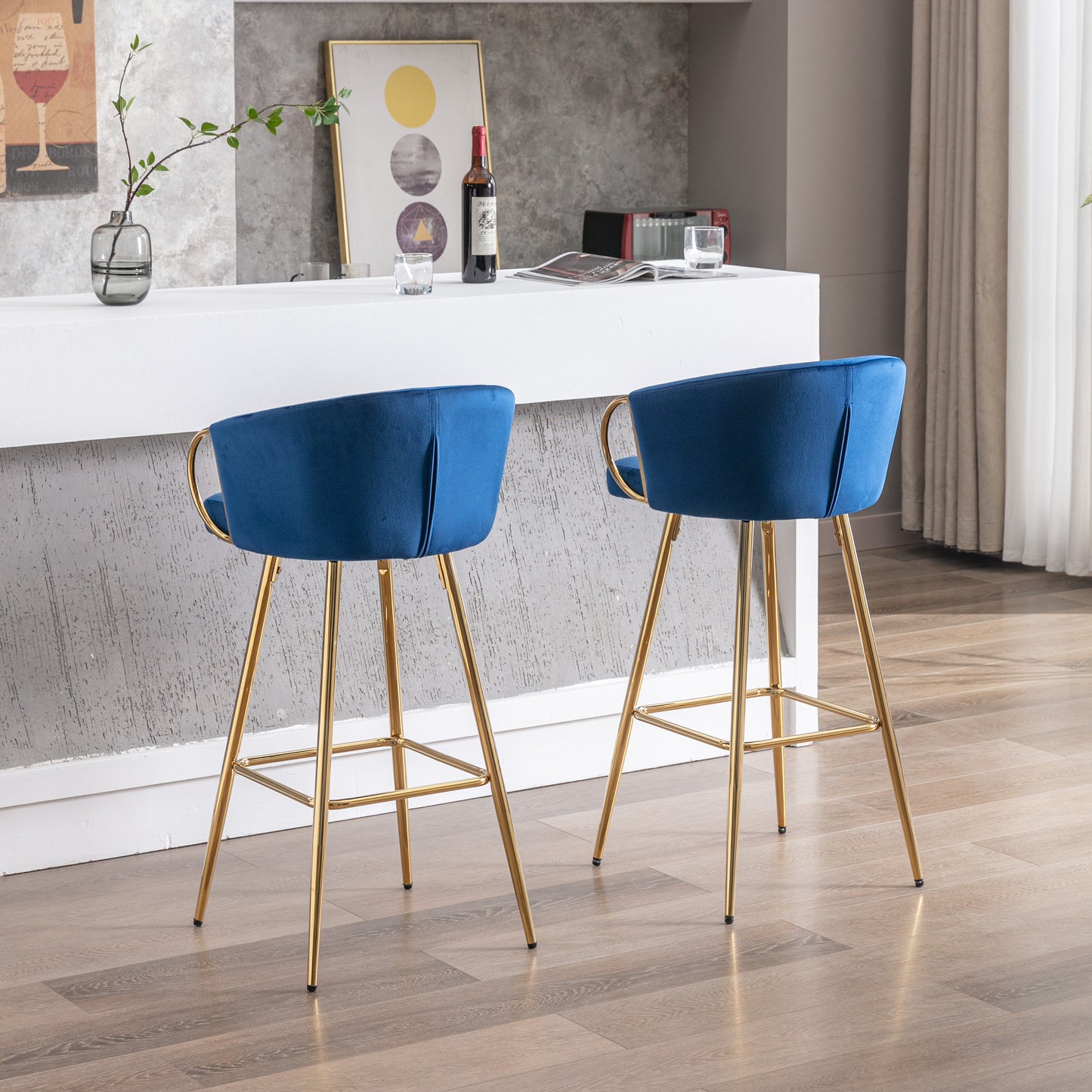 Elegant royal blue velvet bar stool with gold legs and armrests