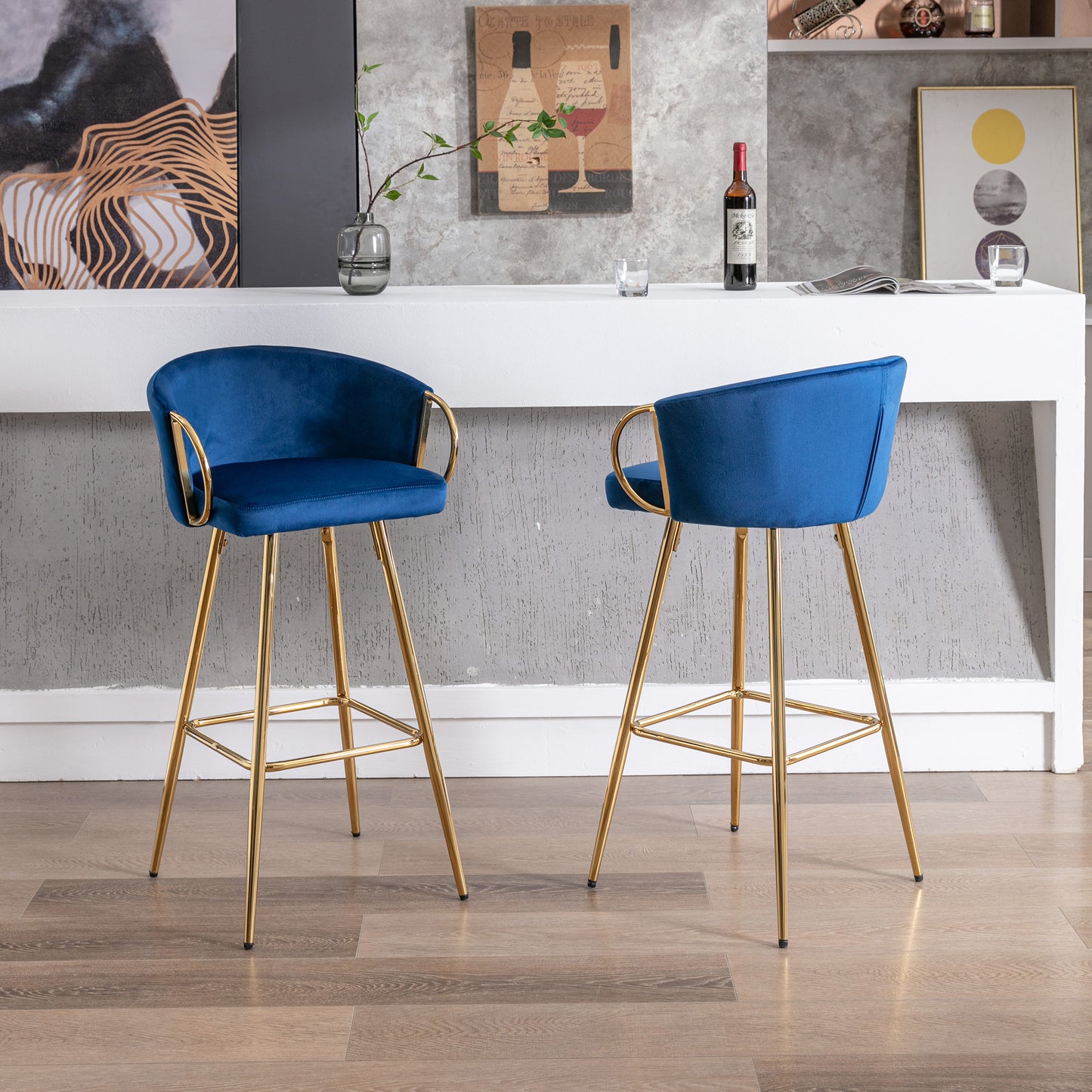 Blue velvet bar stool with gold legs and curved armrests