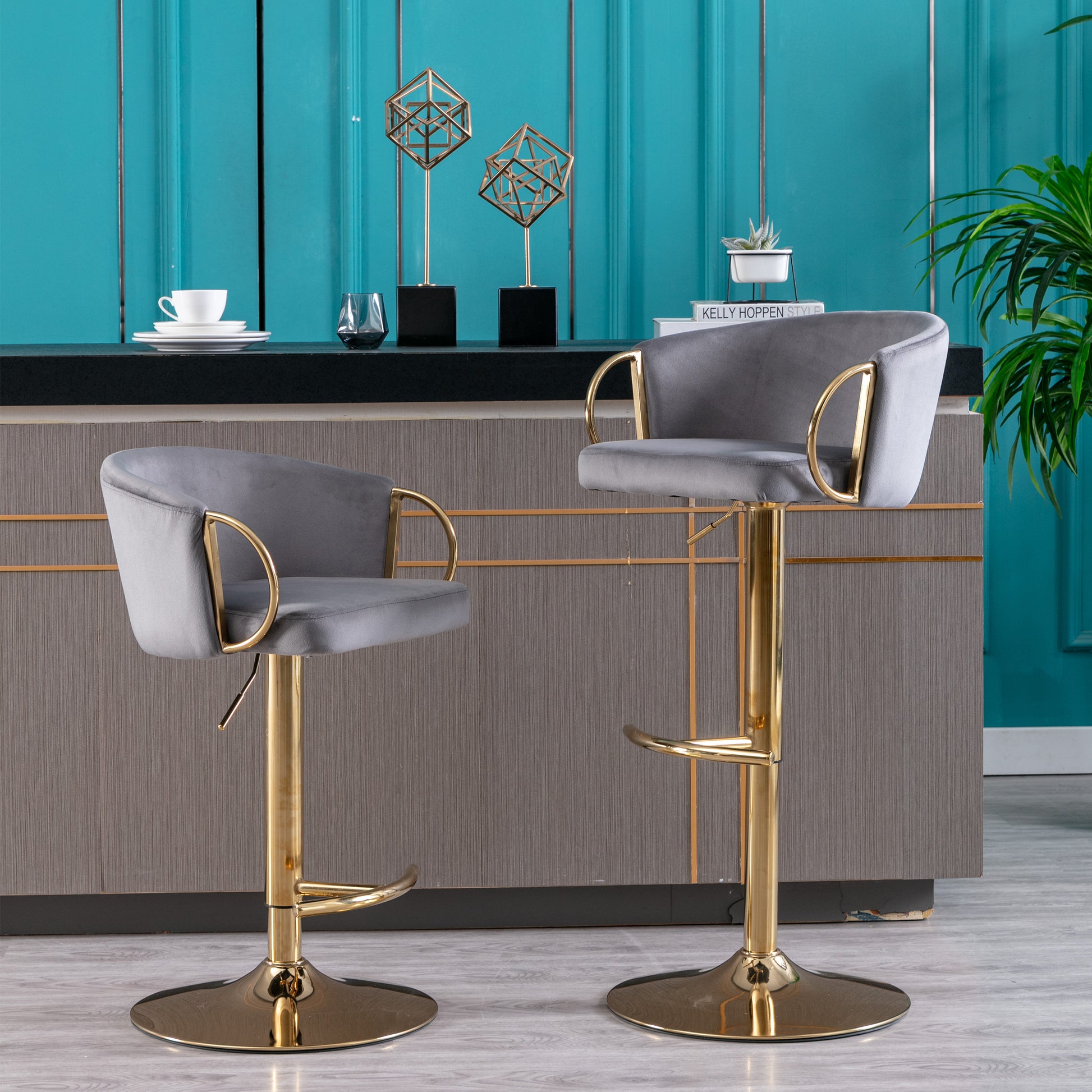 Grey velvet bar stool with gold accents and adjustable height