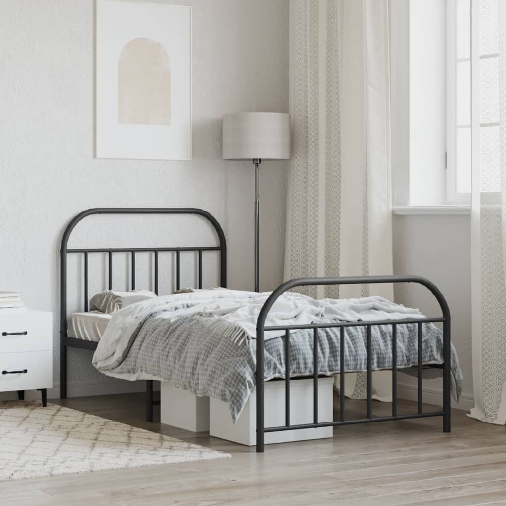 Black metal twin bed frame with arched headboard and footboard