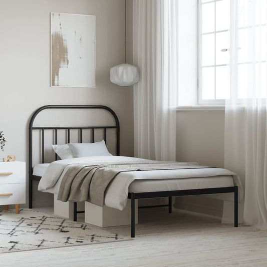 Black metal twin bed frame with arched headboard and footboard