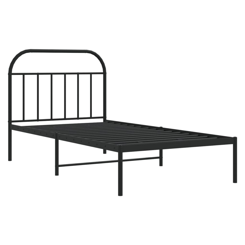Black metal twin bed frame with arched headboard and mattress