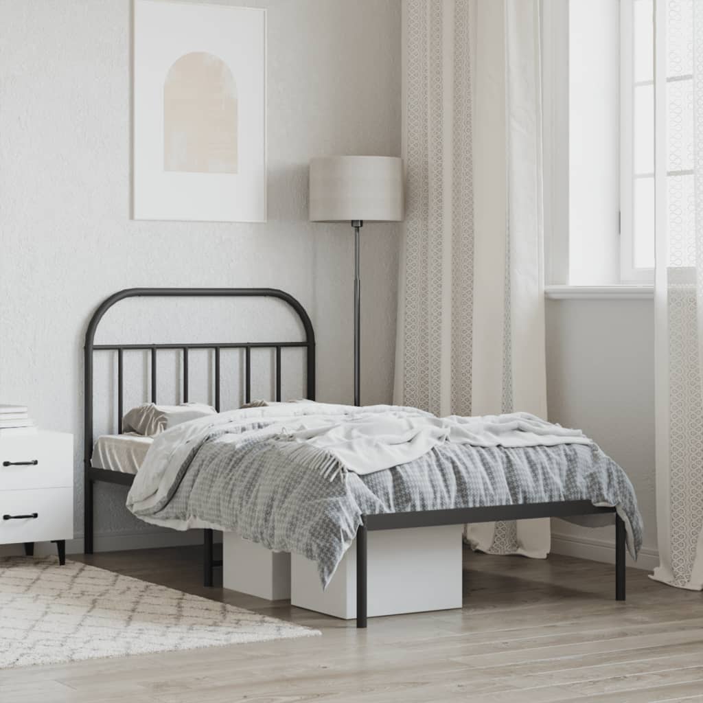 Black metal twin bed frame with arched headboard