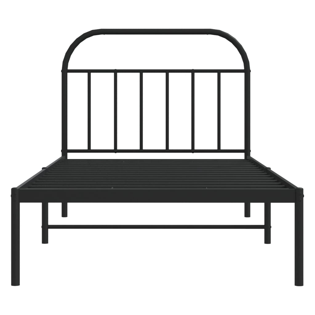 Black metal twin bed frame with arched headboard and mattress