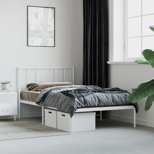 White metal twin bed frame with minimalist headboard and bedding
