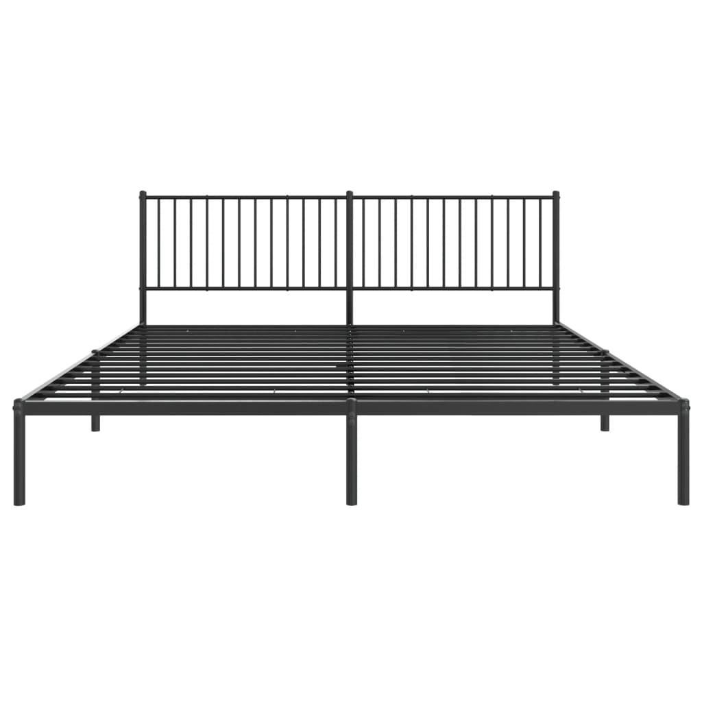 Black metal bed frame with a vertical slat headboard and patterned bedding
