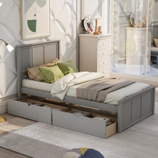 Gray wooden twin bed frame with two storage drawers and green  tan pillows