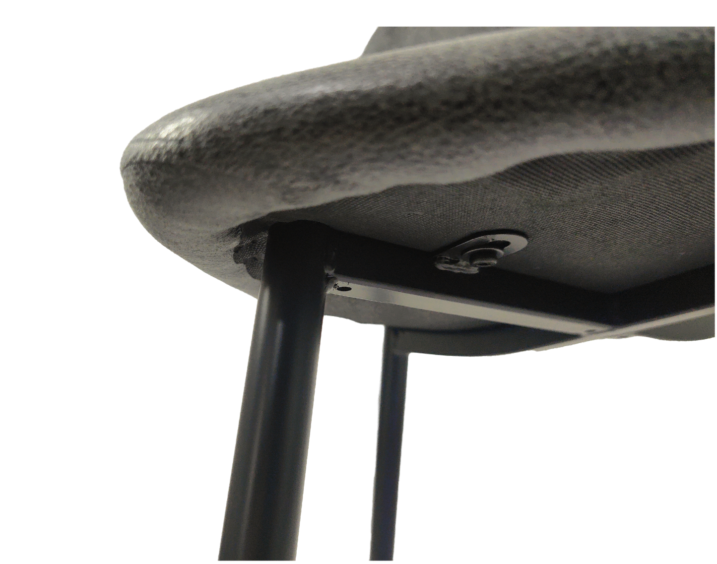 Close up view of textured gray fabric seat cushion edge and metal frame