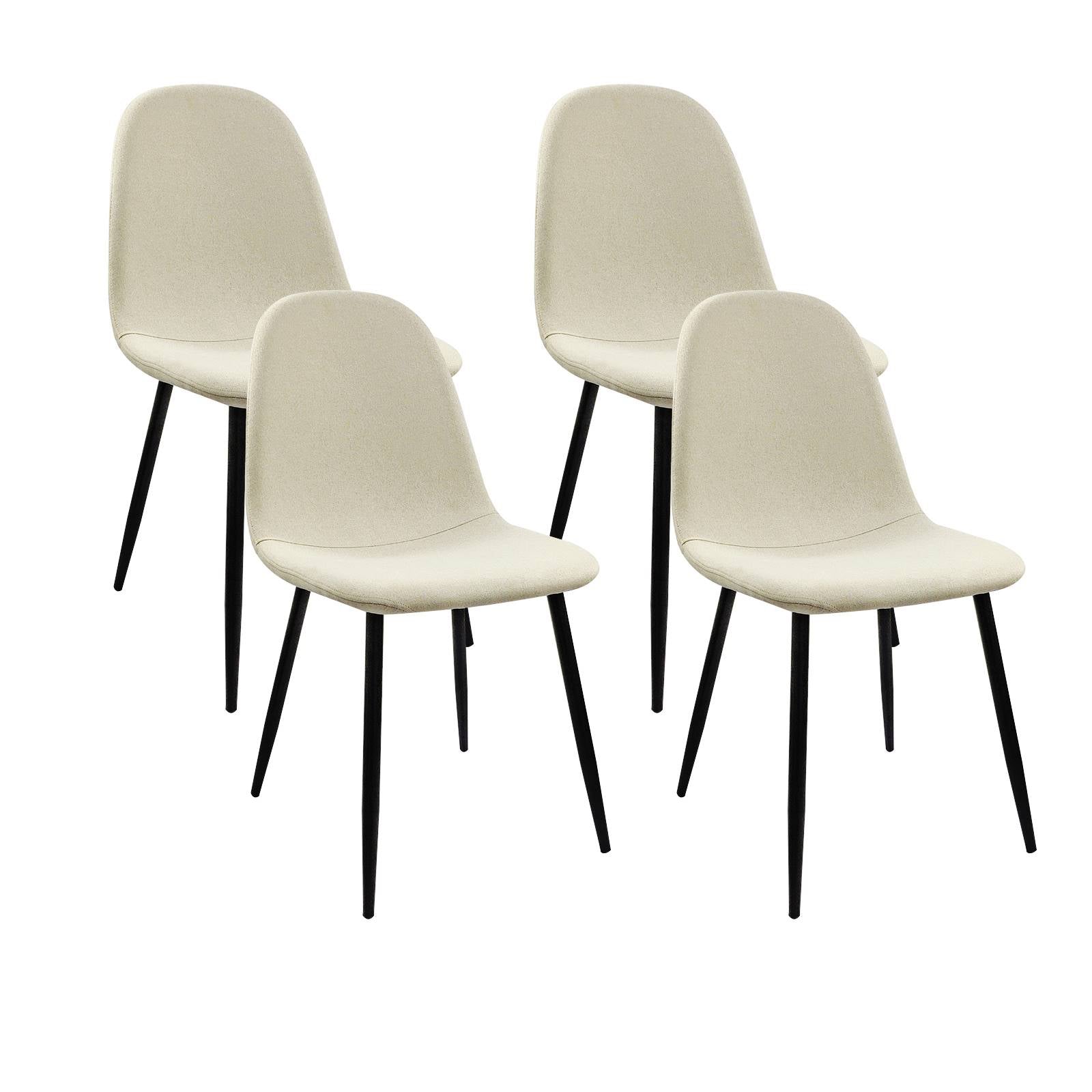 Set of four cream upholstered dining chairs with black tapered legs
