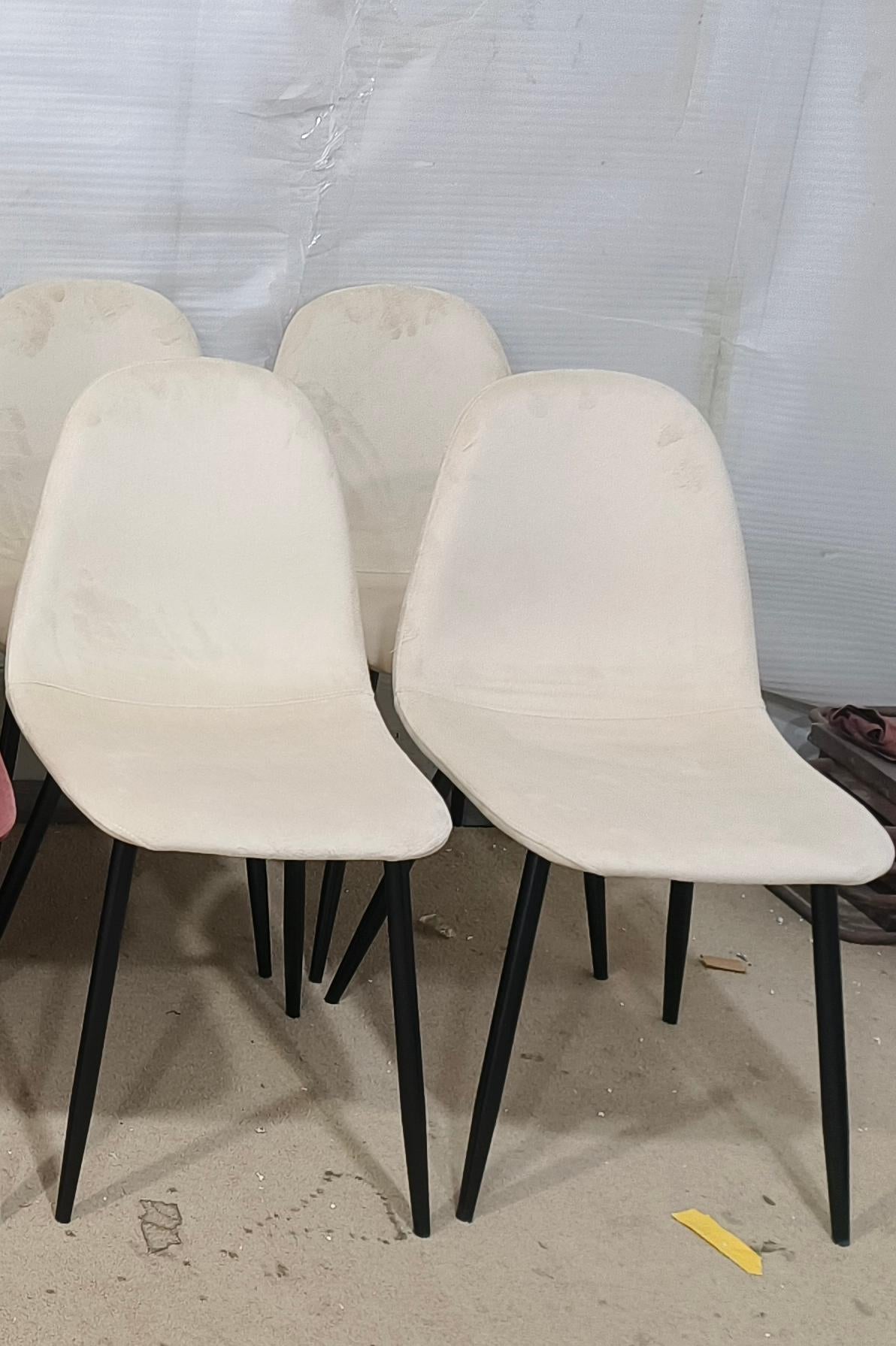 Cream fabric dining chair with black metal legs