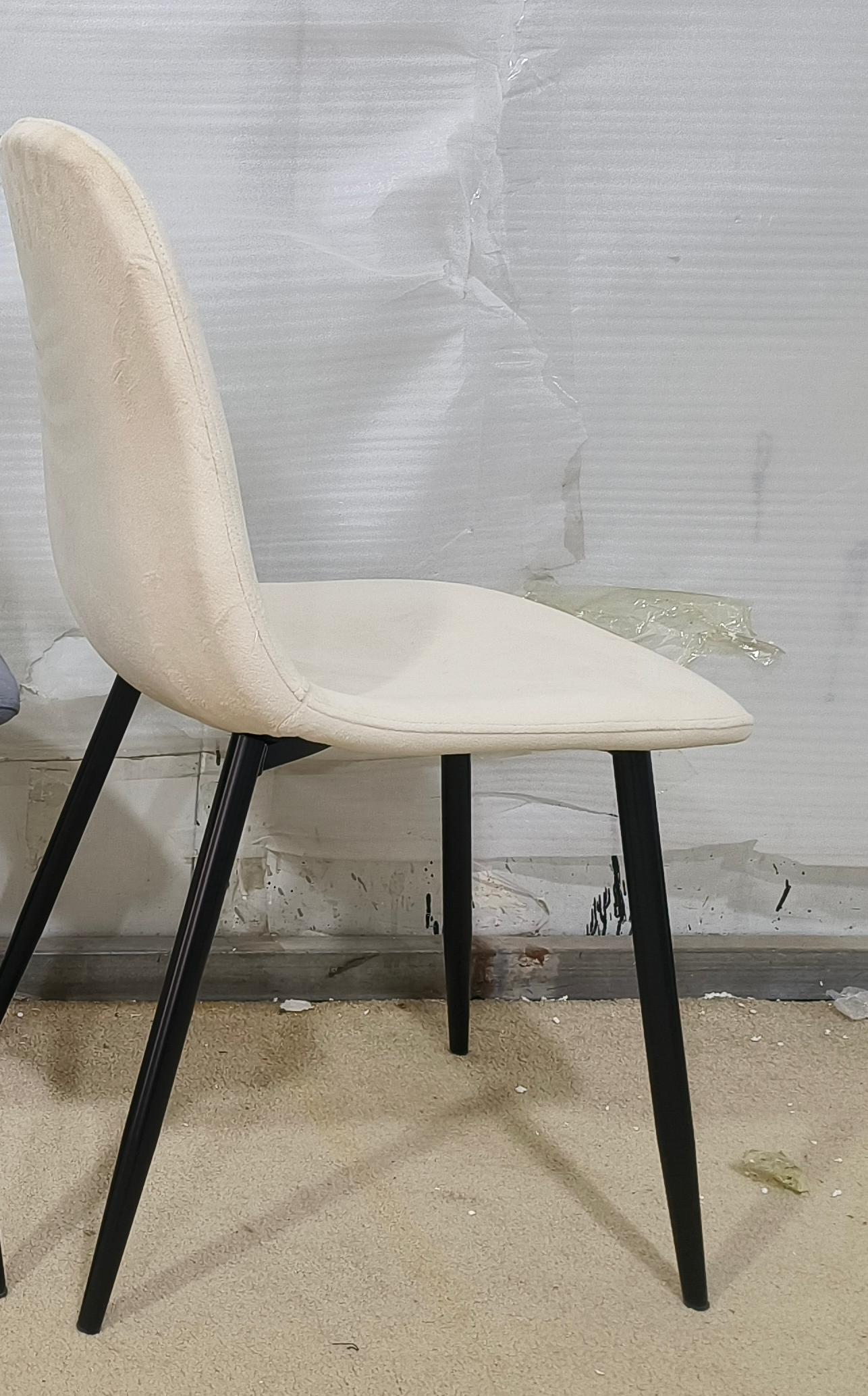Cream velvet accent chair with black metal legs perfect for dining rooms or offices