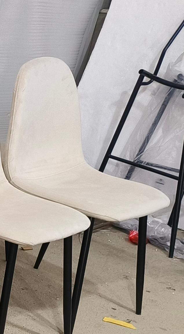 Cream fabric dining chair with black metal legs