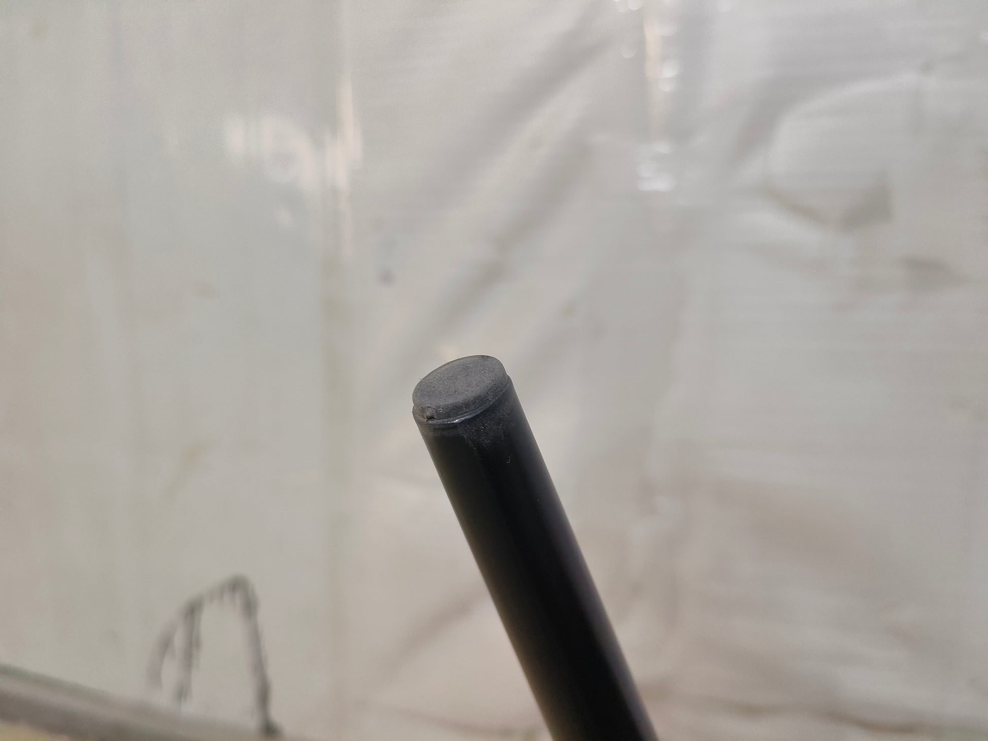 Black metal furniture leg with rubber foot